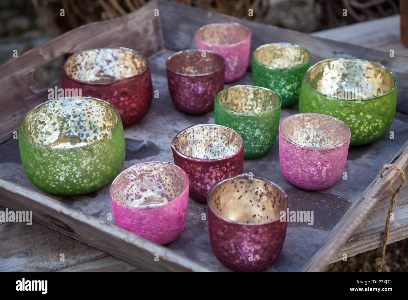 Colorful tealight candle holders on a tray Stock Photo Alamy