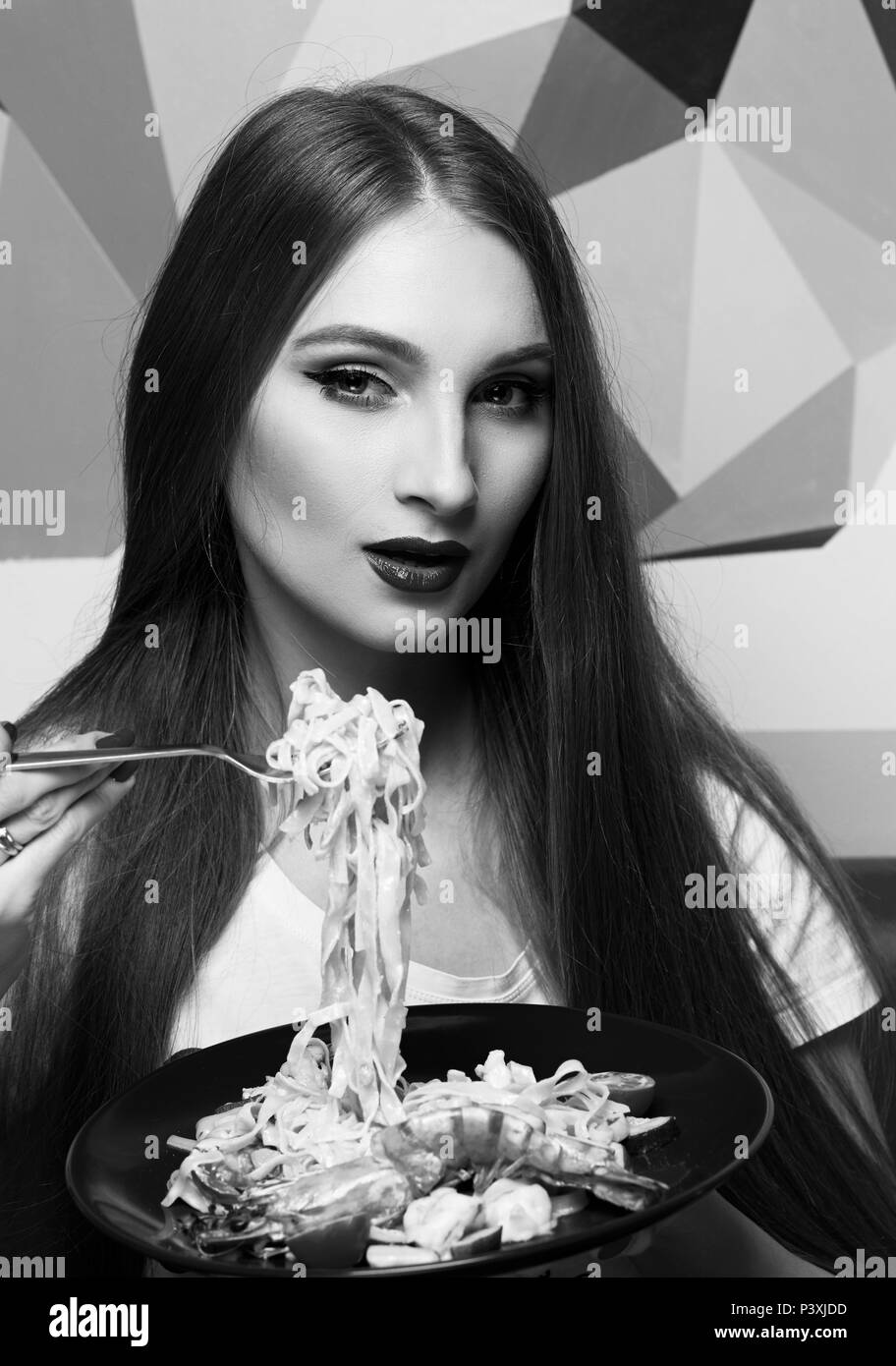 Girl eating pasta Black and White Stock Photos & Images Alamy