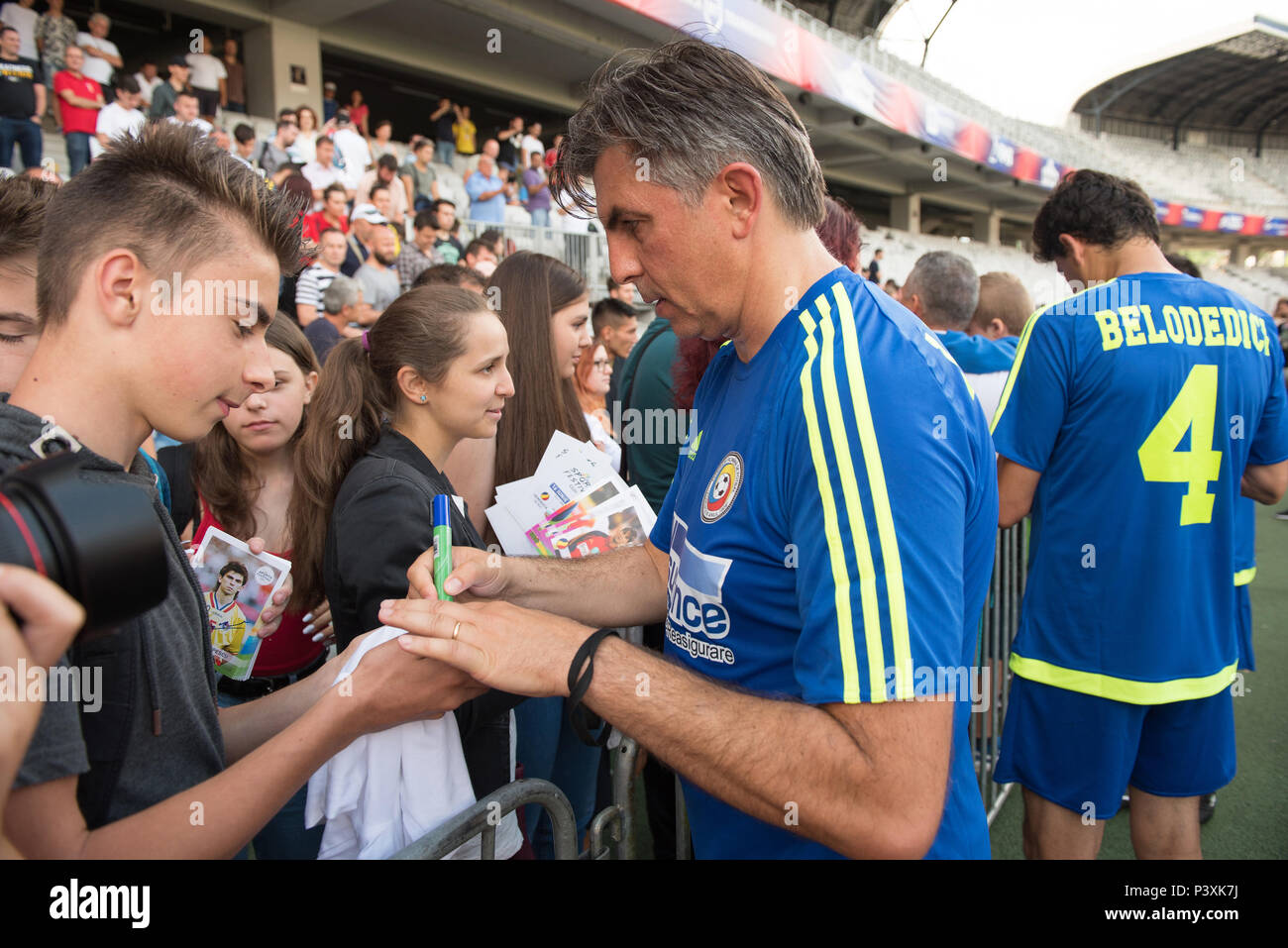 CLUJ NAPOCA, ROMANIA - JUNE 15, 2018: Football players Lupescu and Belodedici from the Golden Team signing autographs during a match against Barcelona Stock Photo