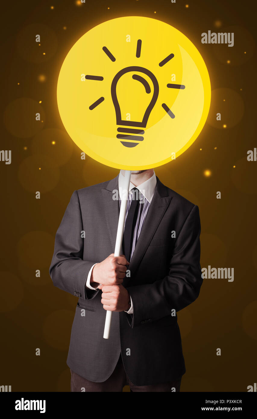 Smart businessman holding round sign with yellow lightbulb Stock Photo