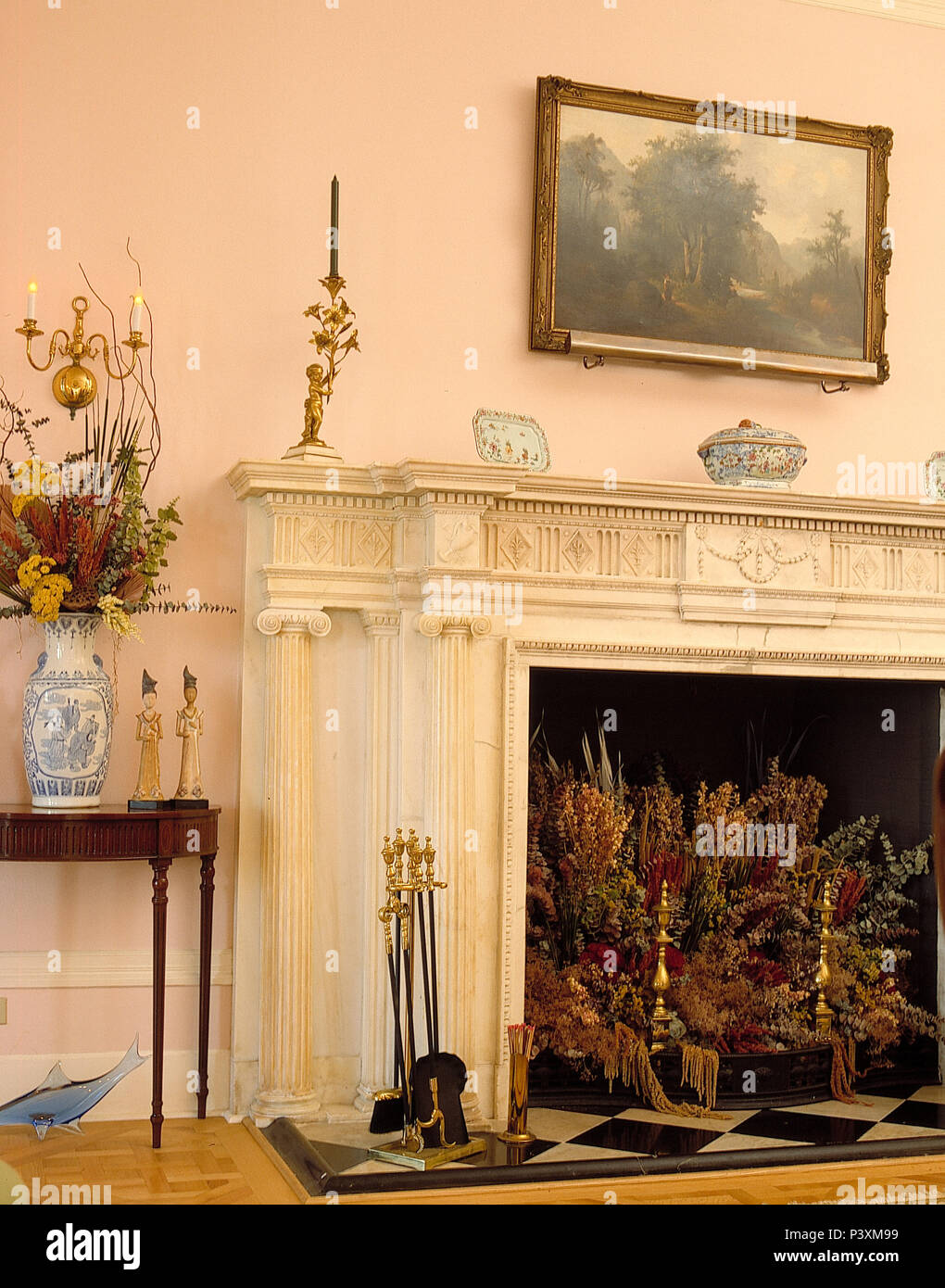 Dried flower arrangement in ornate stone fireplace Stock Photo Alamy