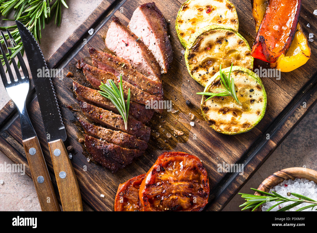 a big piece of freshly prepared grilled meat the chef cuts. Fresh grilled  meat. Grilled beef steak medium rare on wooden cutting board Stock Photo -  Alamy