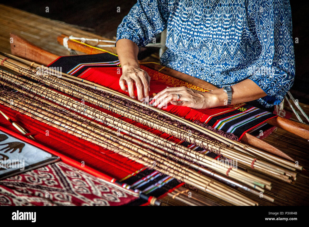 asian woman work at traditional loom Stock Photo