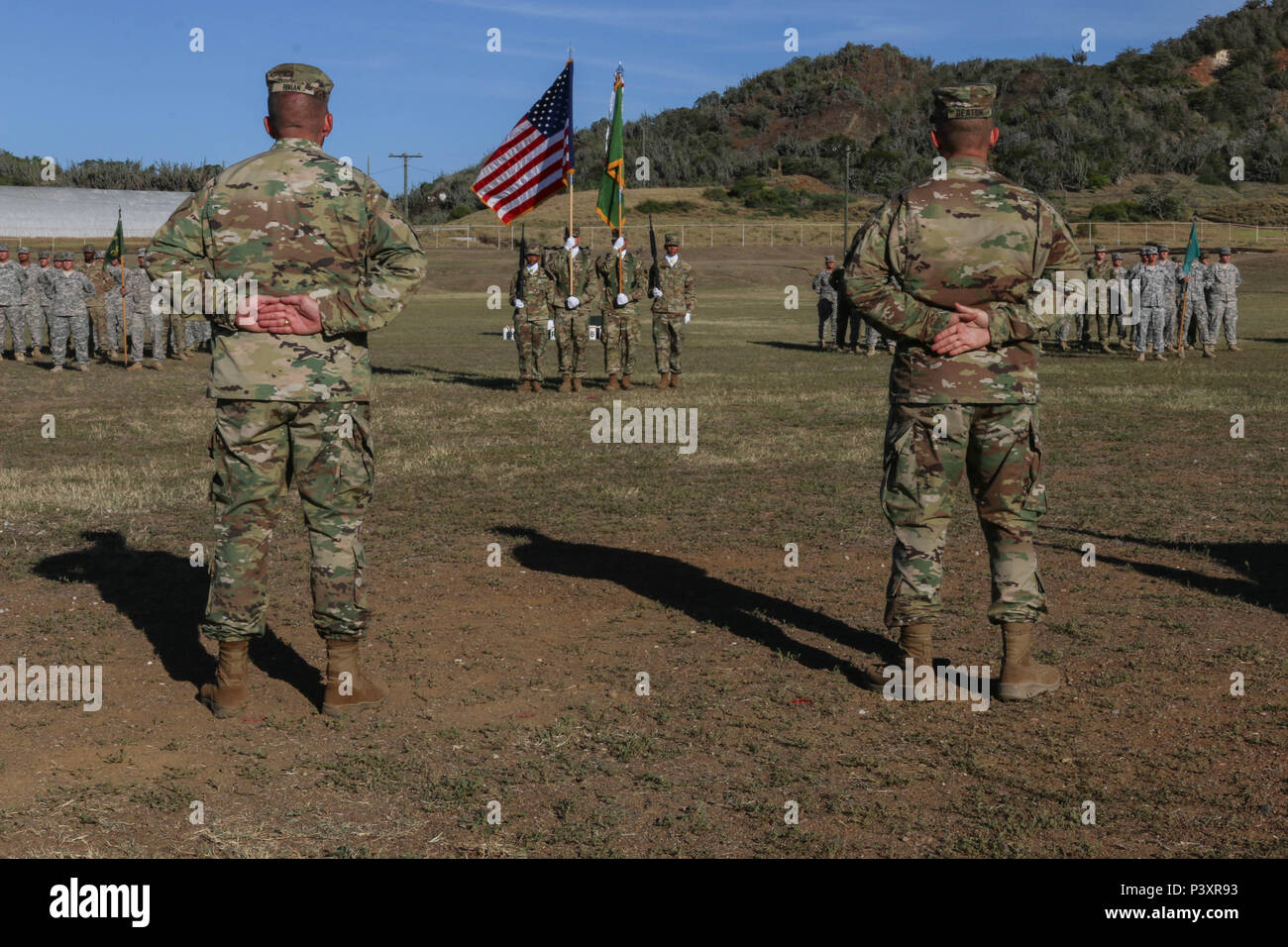 U.S. Army Lt. Col. John A. Fivian (left) and U.S. Army Lt. Col. Andrew Deaton stand in front of the 525th Military Police Detention Battalion during a change of command July 13 at U.S. Naval Station Guantanamo Bay, Cuba. Fivian turned over his command responsibilities of the Vigilant Warriors to Deaton after being the 525th MP Bn. Commander and assigned to Joint Task Force Guantanamo for two years. (Photo by U.S. Army Sgt. Sarah Kirby // RELEASED) Stock Photo
