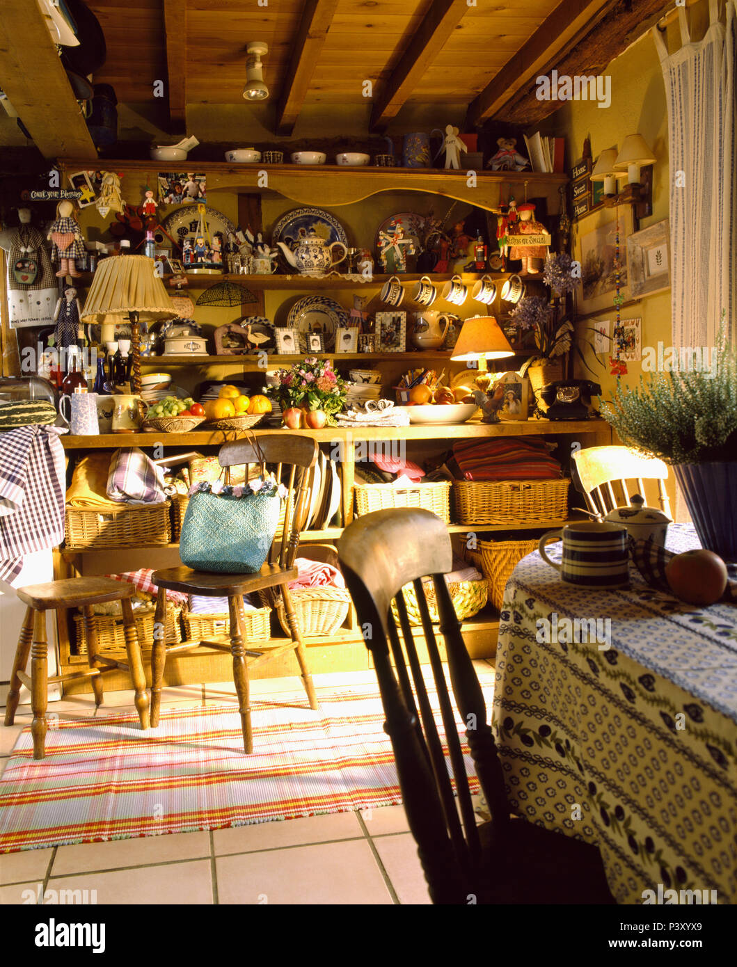 Large Cluttered Pine Dresser In Beamed Cottage Dining Room With