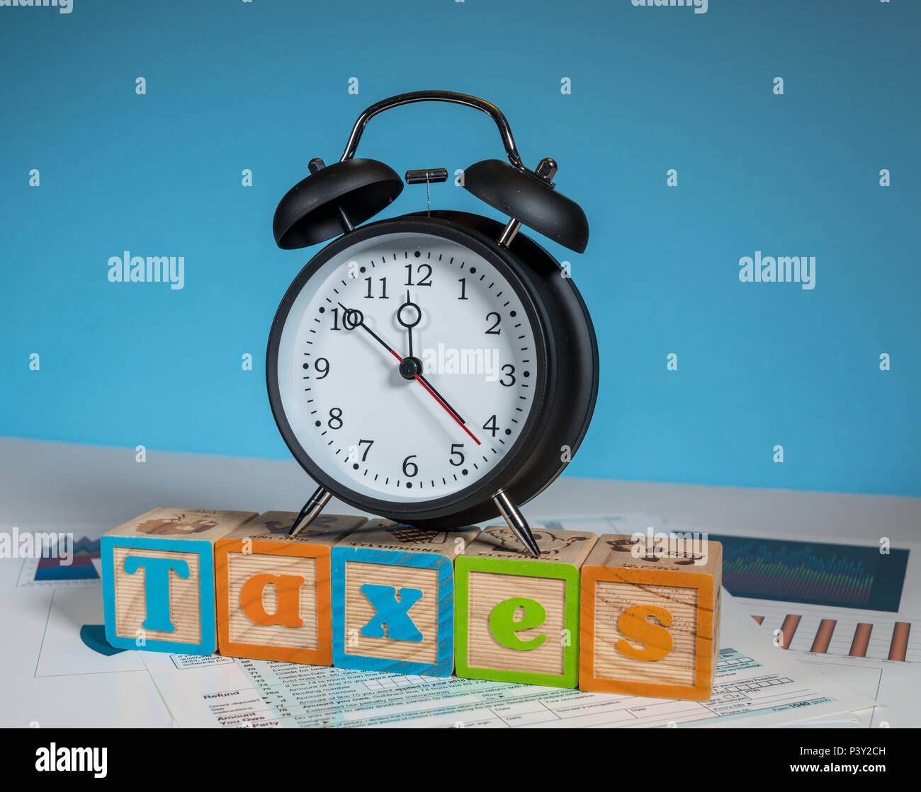 Income tax deadline approaching with alarm clock Stock Photo