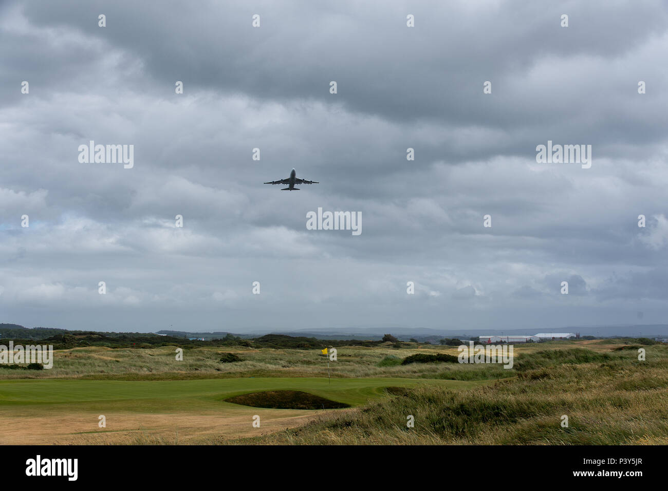 Airplane flies over Royal Troon Golfclub, Troon, United Kingdom Stock Photo