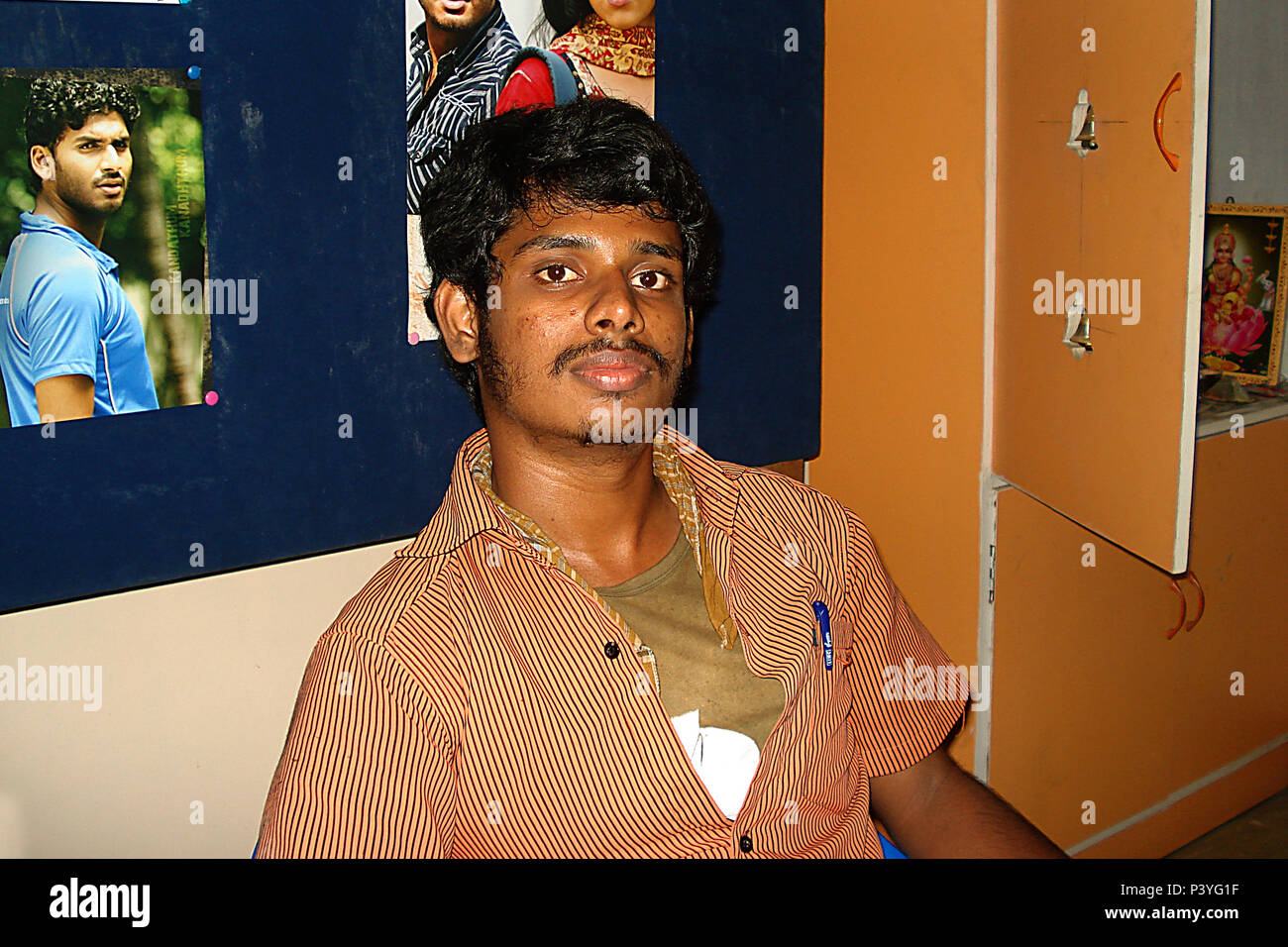 Portrait of smiling happy man sits on the office Stock Photo - Alamy