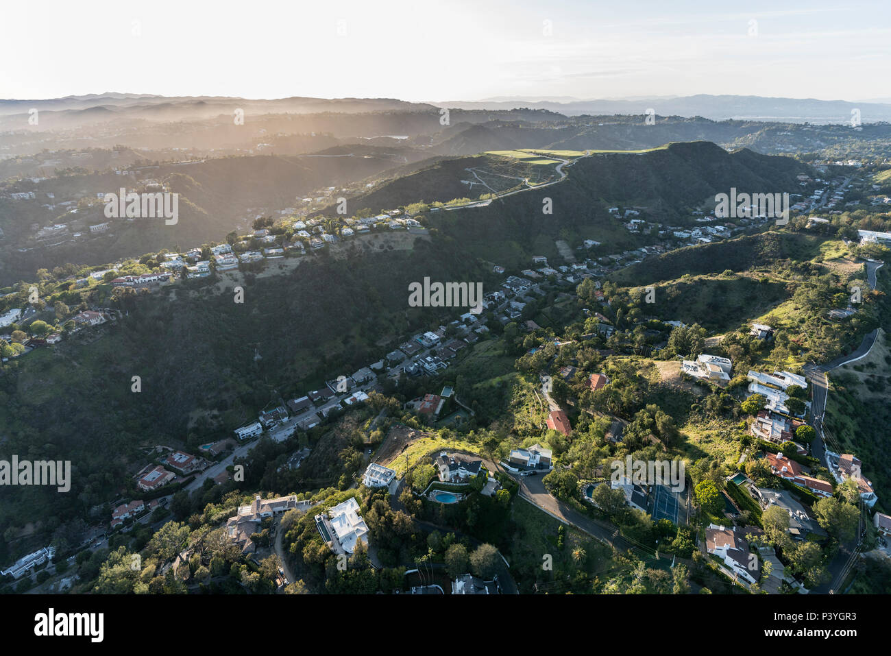 Aerial view of South Beverly Park canyon and hilltop homes in the Santa Monica Mountains above Beverly Hills and Los Angeles, California. Stock Photo