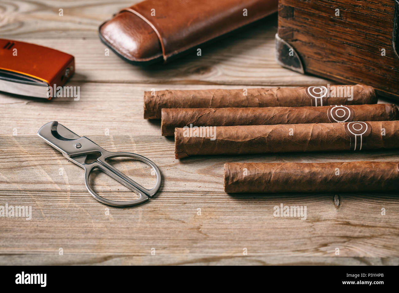 Cuban cigars and smoking accessories on wooden background, view from above  Stock Photo - Alamy