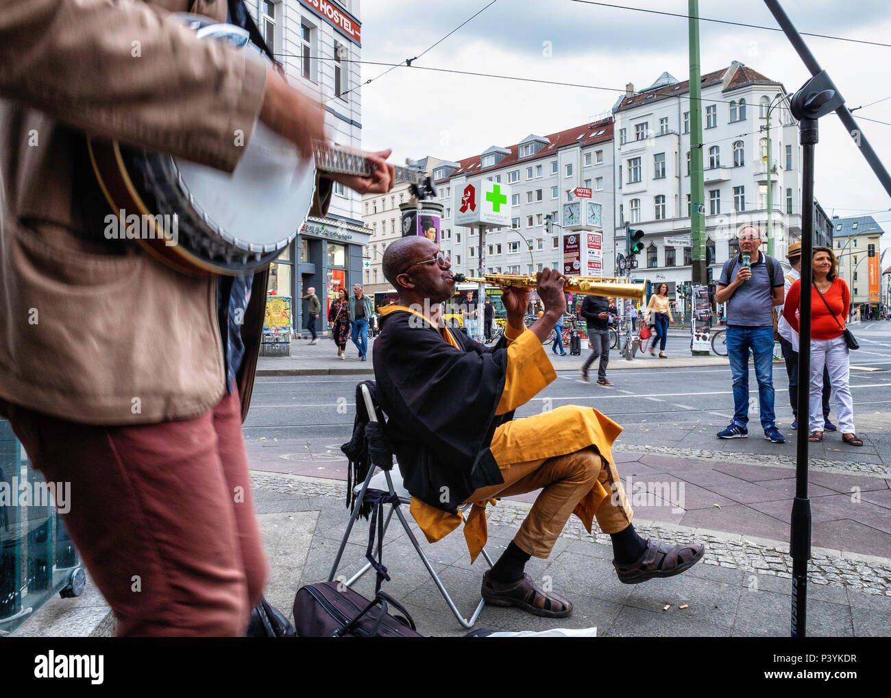 Three playing musical instruments hi-res stock photography and images ...