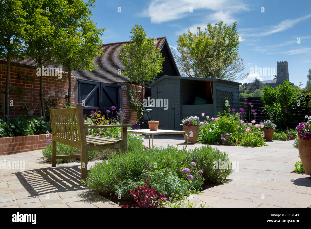 Overview of garden patio with view to St. Mary's Church in Kersey Stock