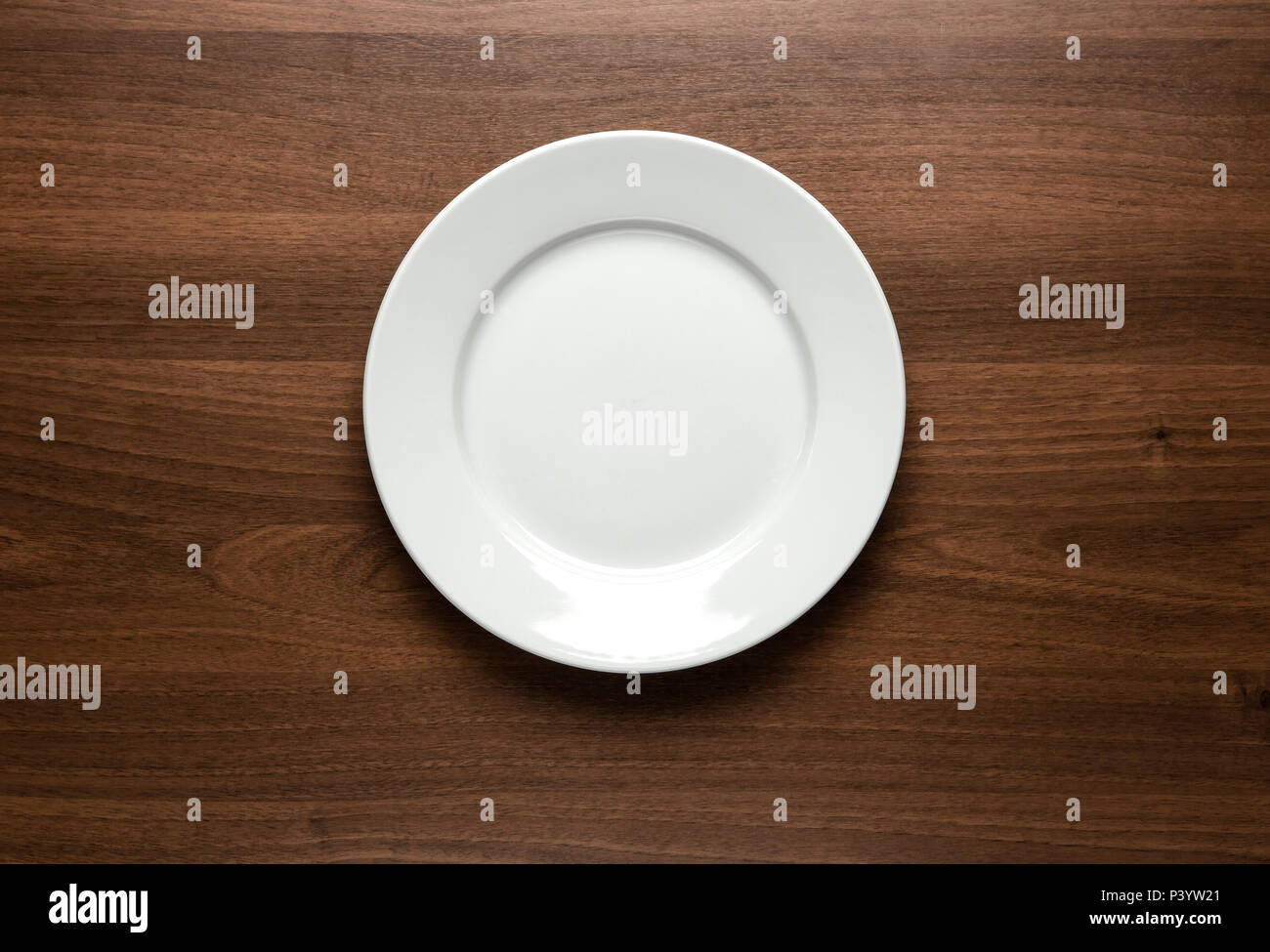 Empty plate on wooden table with copy space Stock Photo Alamy
