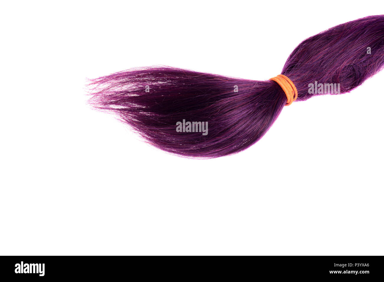 isolated purple weft of hair with ponytail holder Stock Photo