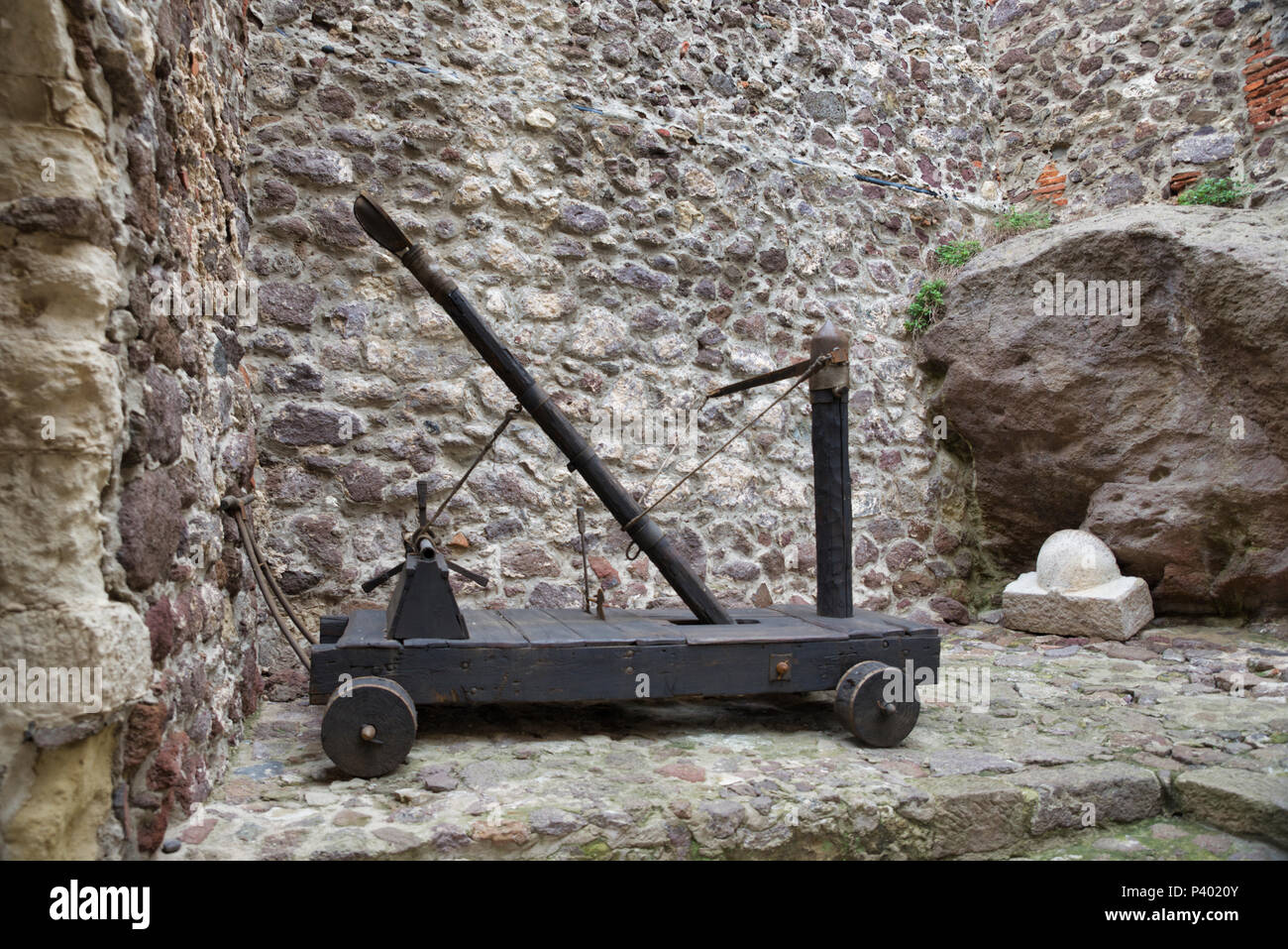 Wooden medieval catapult ballistic device, used to catapult stones to the ennemy Stock Photo