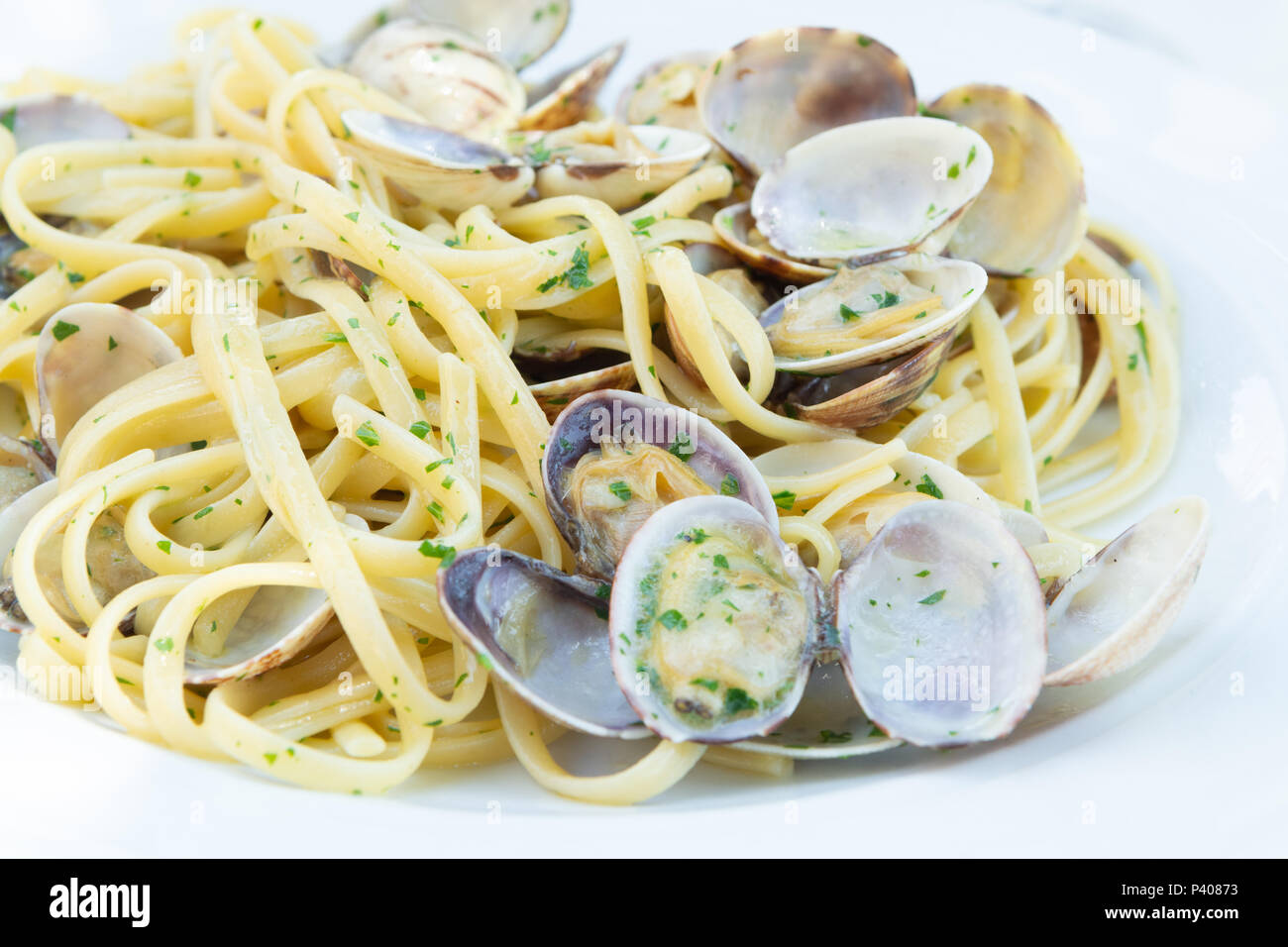 Traditional Italian seafood, spaghetti vongole made with seashells and