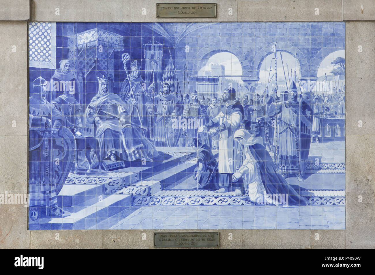 Knight Egas Moniz presenting himself to Emperor Alfonso VII in Toledo offering his life, his wife and his sons during the siege of the Castle of Guimarães in 1127. Azulejo panel painted by Portuguese painter Jorge Colaço in 1905-1916 in the São Bento railway station (Estação Ferroviária de São Bento) in Porto, Portugal. Stock Photo