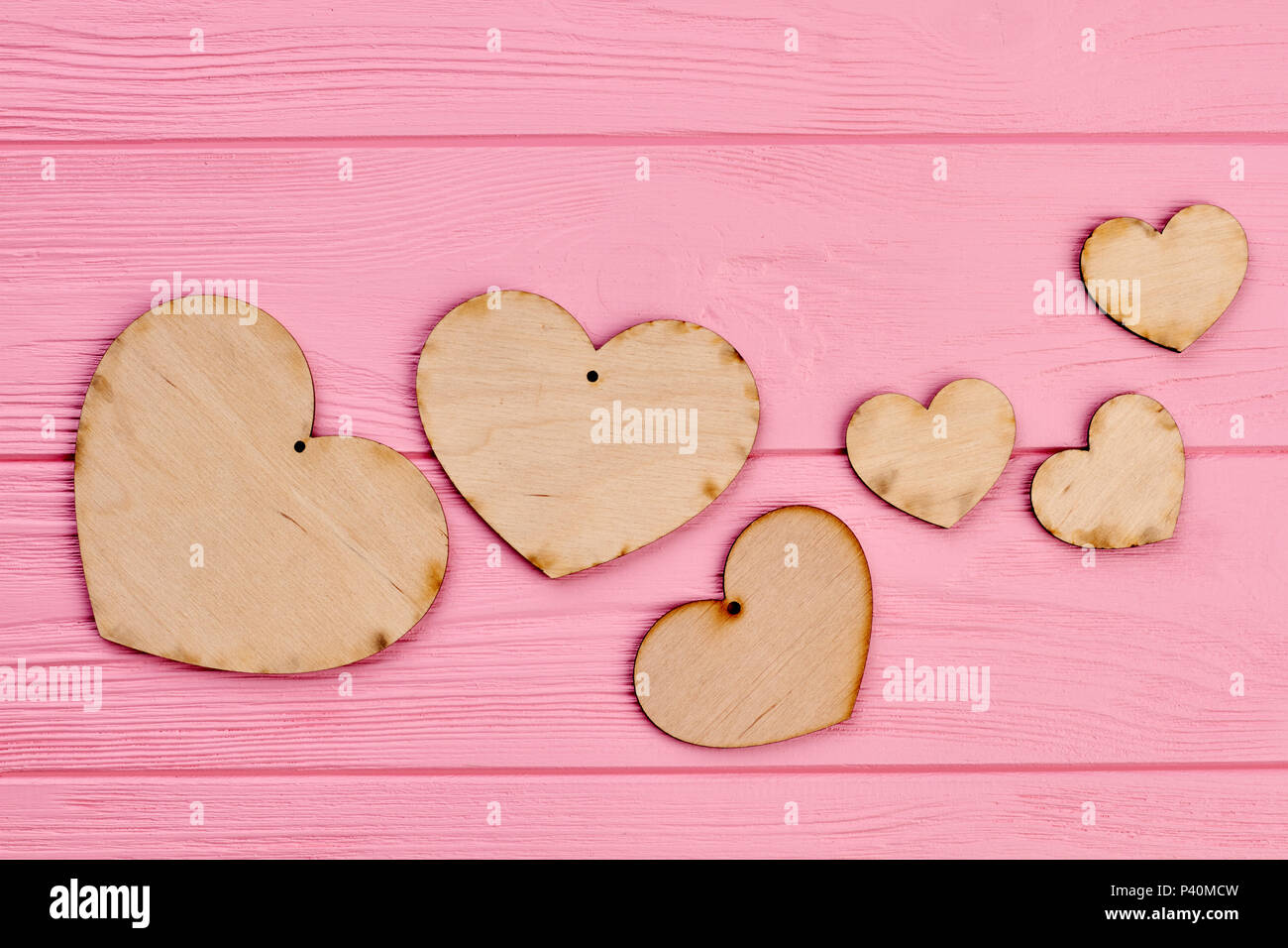 Valentines Day Wooden Hearts On Pink Background Heart Shaped