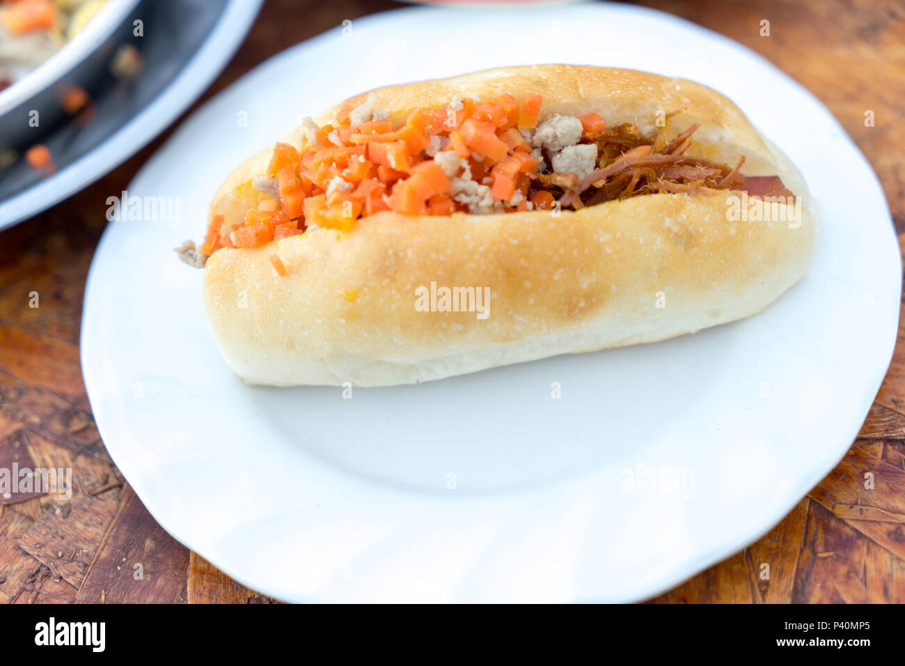 Northeastern Thai breakfast with French bread stuff with minced pork and sausage, also common for Vietnamese and Laos people Stock Photo