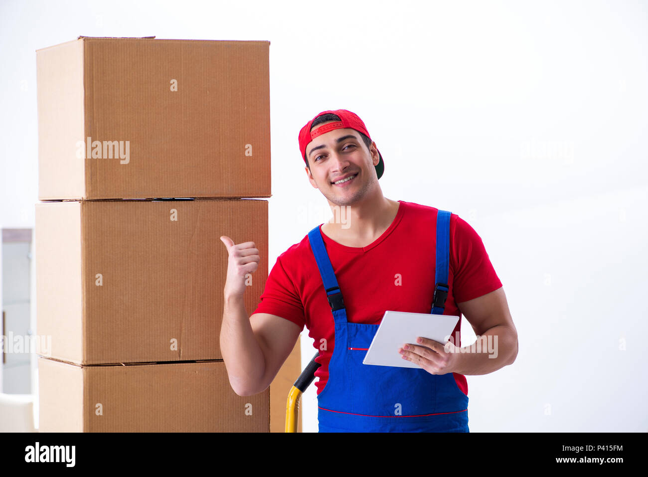 Contractor worker moving boxes during office move Stock Photo - Alamy