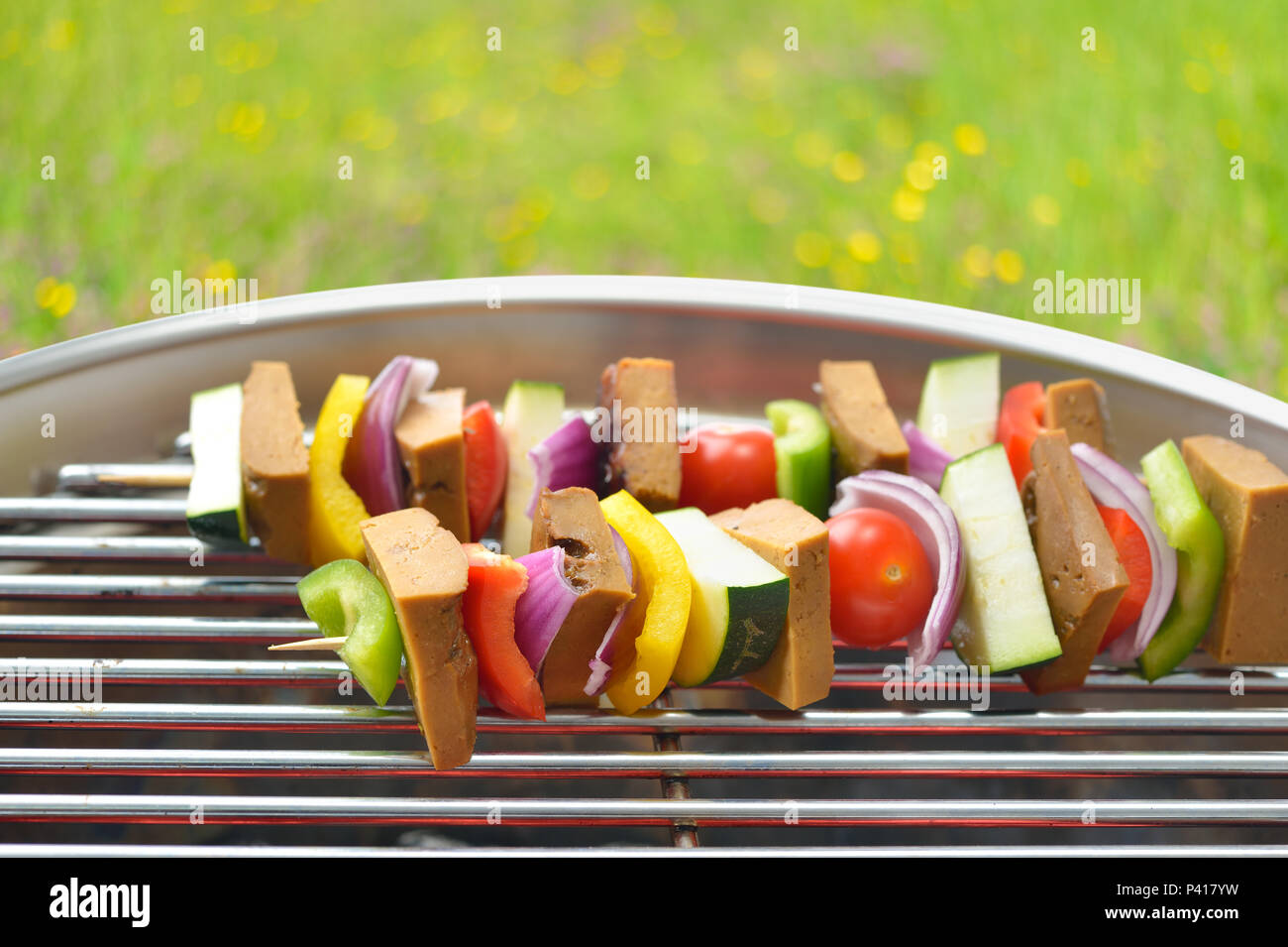 Meatless grilling: Vegetarian skewers with seitan and mixed vegetables on a grill Stock Photo