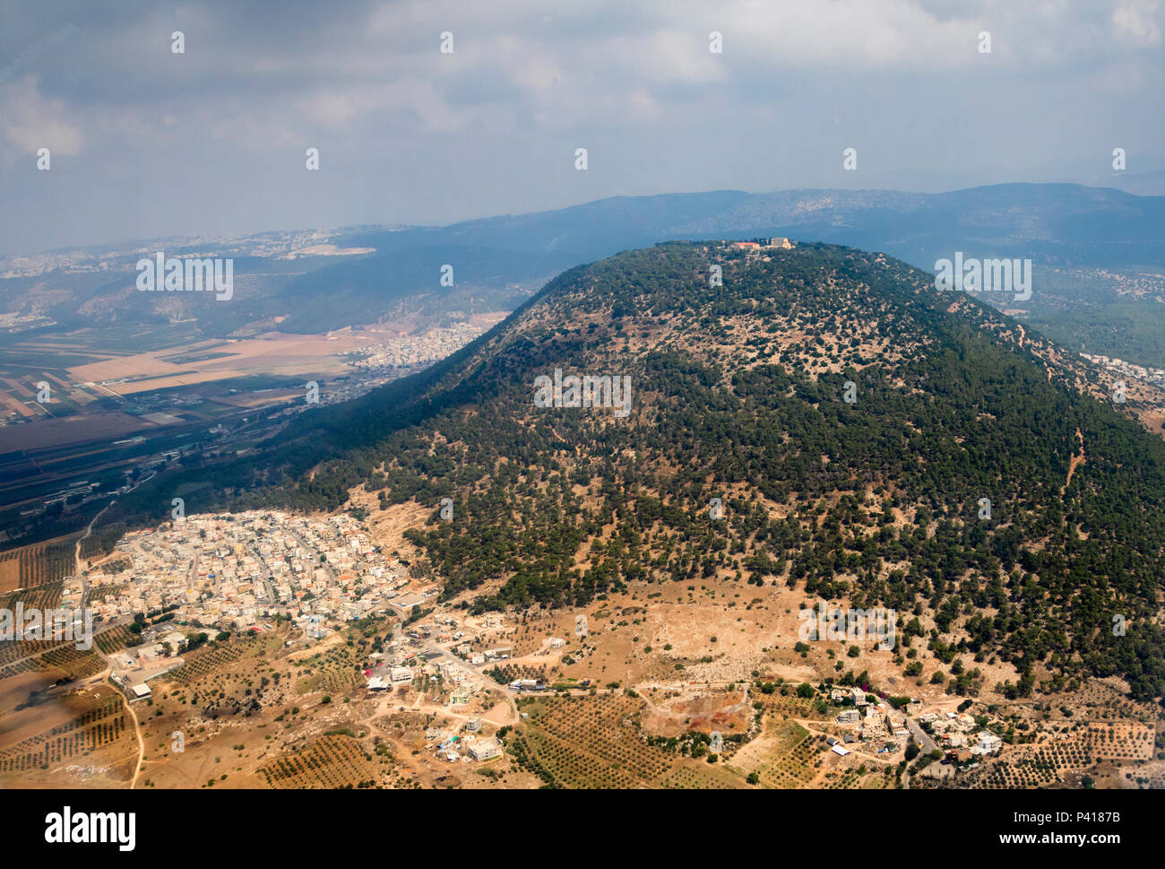 Biblical Mount Tabor, Mount of Transfiguration with Arab village Daburiyya at the base, northern Biblical Mount Tabor, Mount of Transfiguration with Arab village Daburiyya at the base, northern