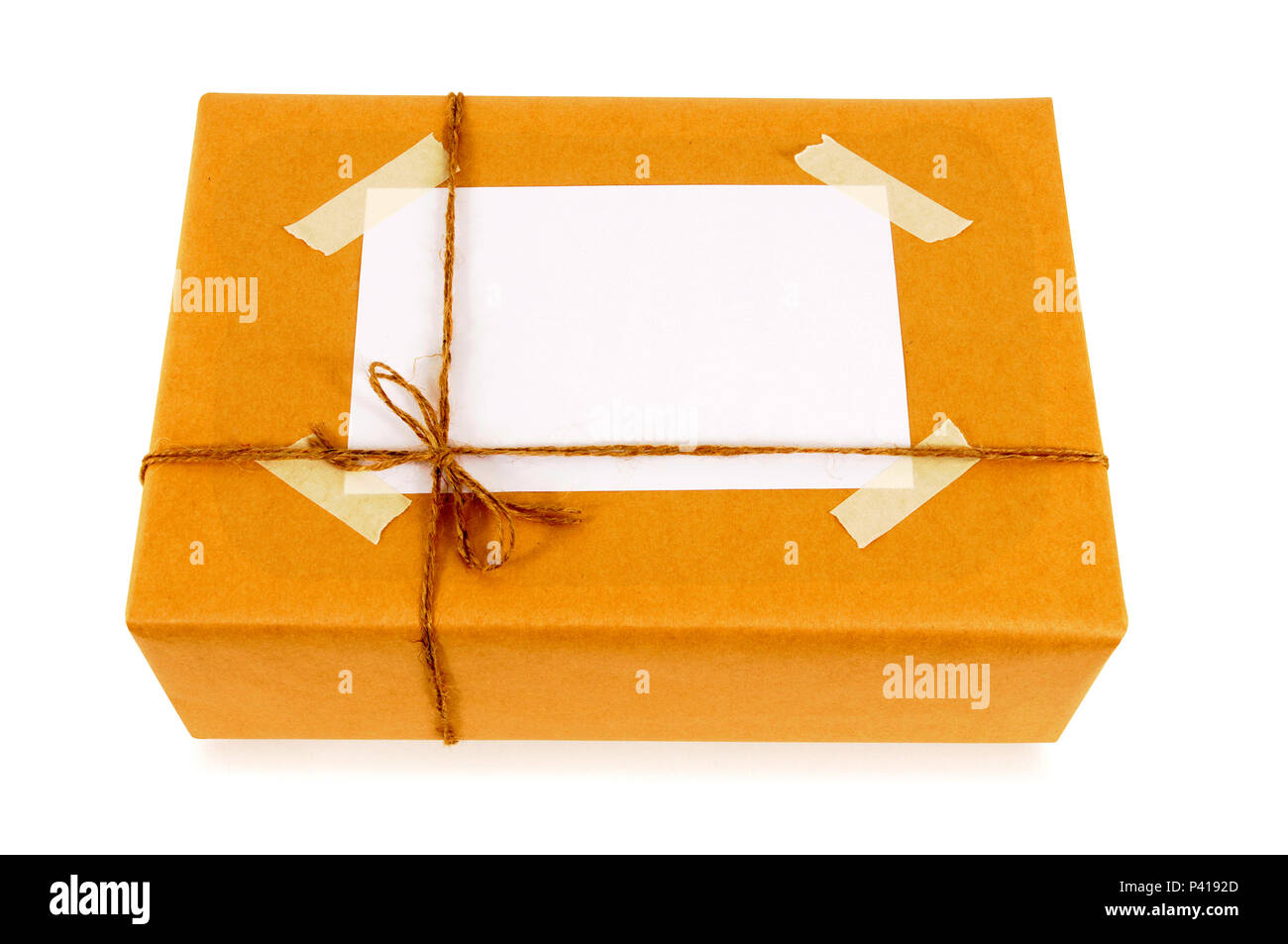 Brown paper parcel with address label Stock Photo Alamy