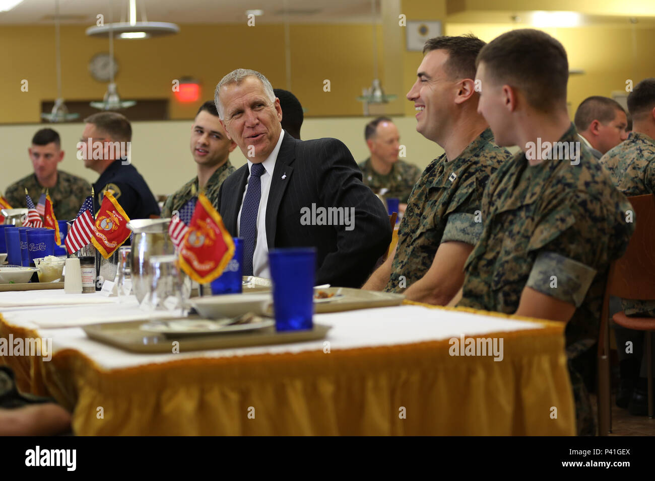 Sen. Thom Tillis shares a meal with Marines at the mess hall during a visit at MCAS Cherry Point, N.C., June 1, 2016. Tillis visited the air station to address the needs and priorities of the base, and assess the Marine Corps’ presence in North Carolina. Tillis also toured Fleet Readiness Center East. Tillis is a North Carolina senator. (U.S. Marine Corps photo by Lance Cpl. Mackenzie Gibson/Released) Stock Photo