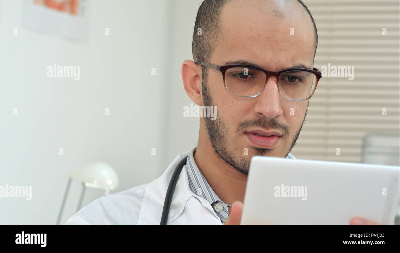 Male medical worker using digital tablet Stock Photo