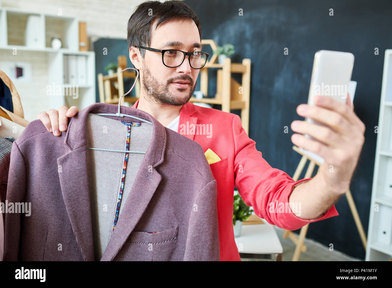 Trendy blogger taking selfie with jacket Stock Photo