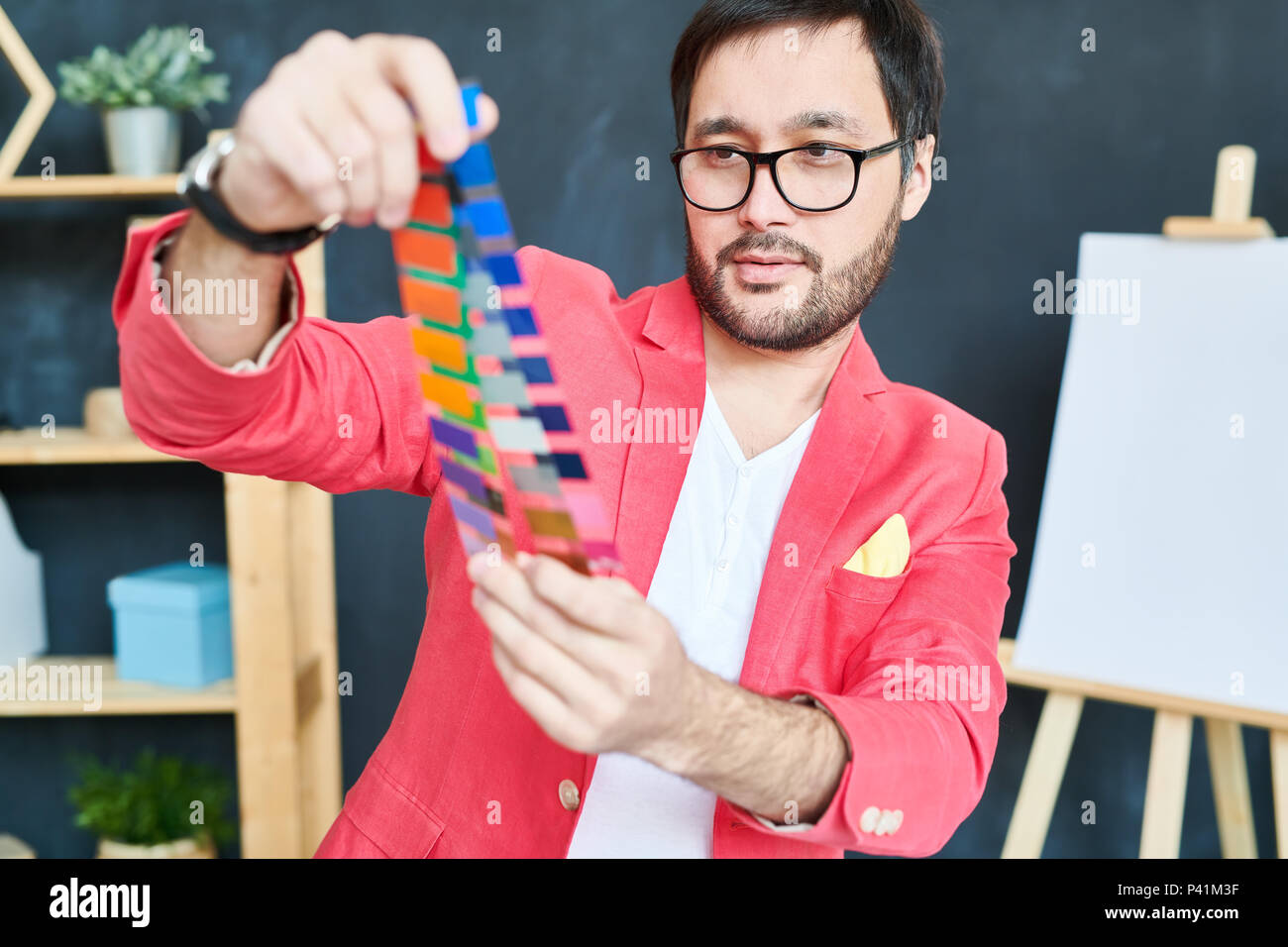 Creative designer working with coloring palettes Stock Photo