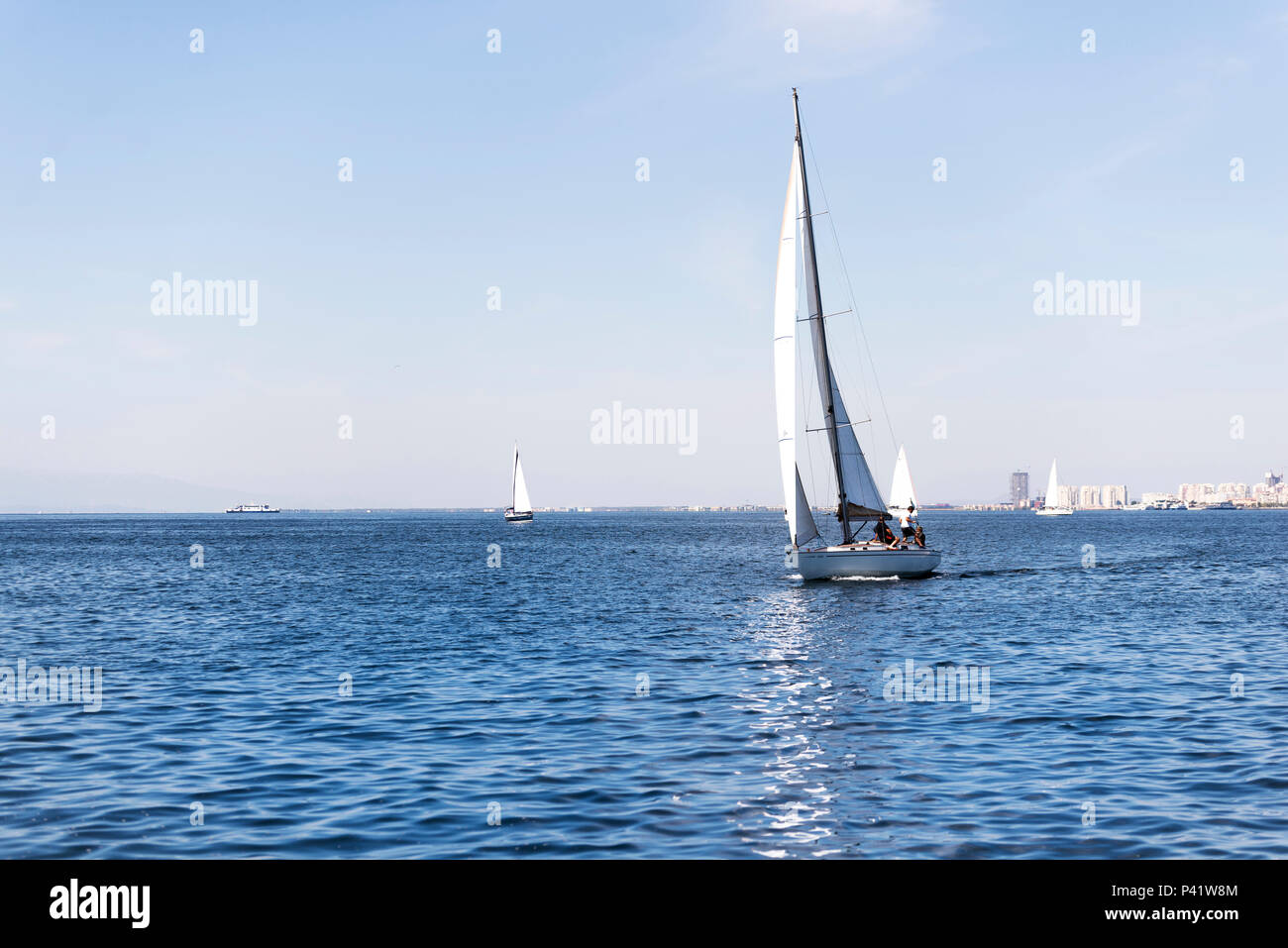 Izmir, Turkey - September 24, 2017: Izmir Gulf Festival, there are four sailboats over the sea and some people on it. Stock Photo