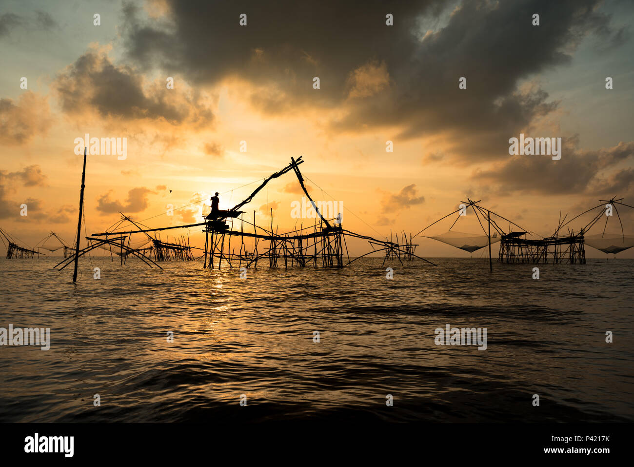 Silhouette Of Fish Lift Nets In Morning At Pakpra, Phatthalung, Thailand  Stock Photo, Picture and Royalty Free Image. Image 59952997.