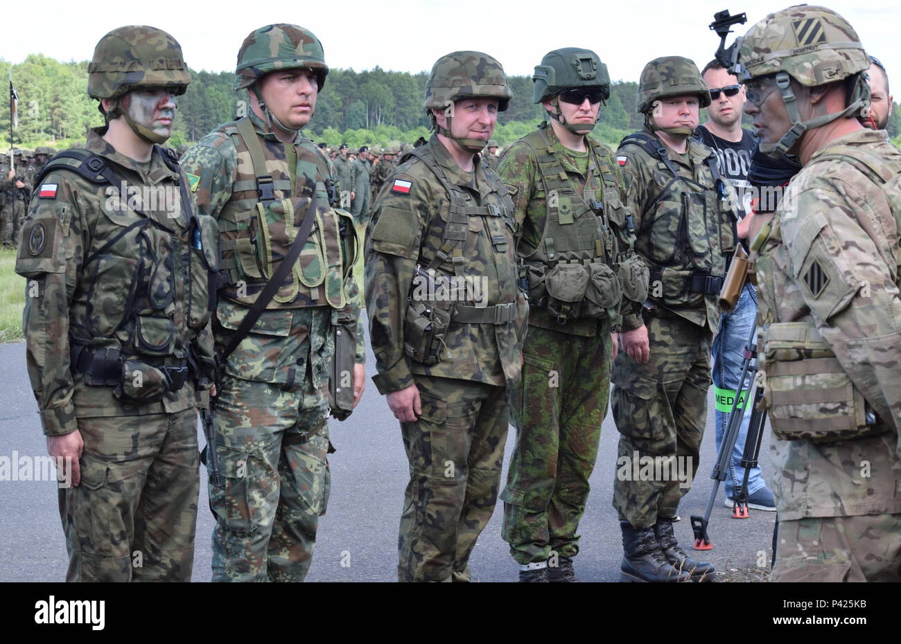 Col. Phil Brooks, the commander of the 1st Armored Brigade Combat Team, 3rd Infantry Division, addresses a group of multinational Soldiers during an opening ceremony marking the official start of Exercise Anakonda 16 at Drawsko Pomorskie, Poland June 6. Anakonda 16 is a Polish-led exercise taking place throughout Poland from June 7-17. It involves over 25,000 participants from more than 20 nations. Anakonda 16 is a premier event for U.S. Army Europe, allied and partnered nations that supports assurance and deterrence measures by demonstrating Allied defense capabilities to deploy, mass and sus Stock Photo