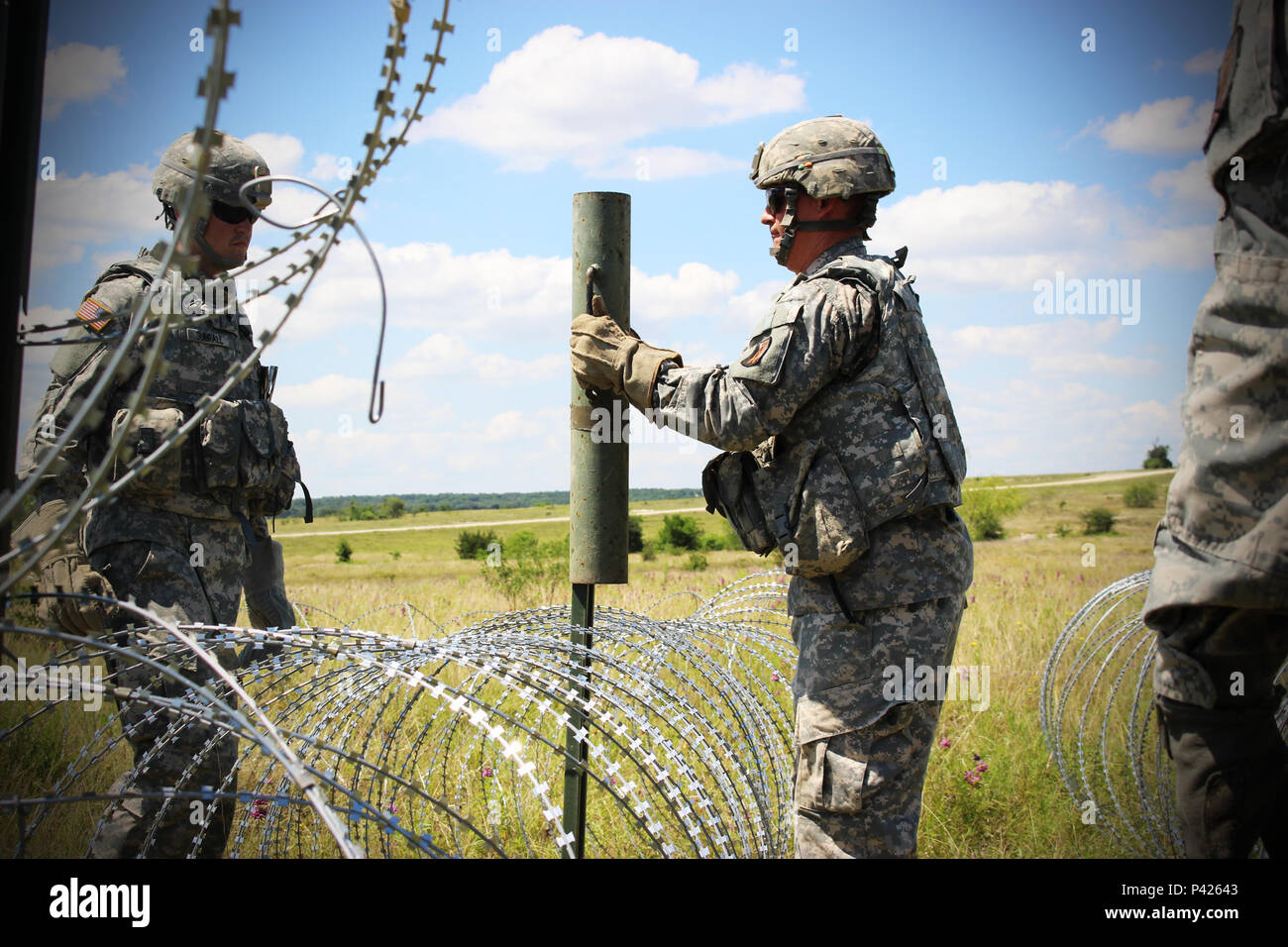Soldiers of the 287th Engineer Company, 890th Engineer Battalion, set up an Entry Control Point at the Command Post of the Special Troops Battalion, 155th Armored Brigade Combat Team on June 7, 2016, at Fort Hood, Texas. The 287th En. Co. is an enabler unit for the 155th Armored Brigade Combat Team’s Multi-integrated Echelon Brigade Training Exercise. (Mississippi National Guard photos by Sgt. Brittany Johnson 155th Armored Brigade Combat Team Public Affairs/Released) Stock Photo