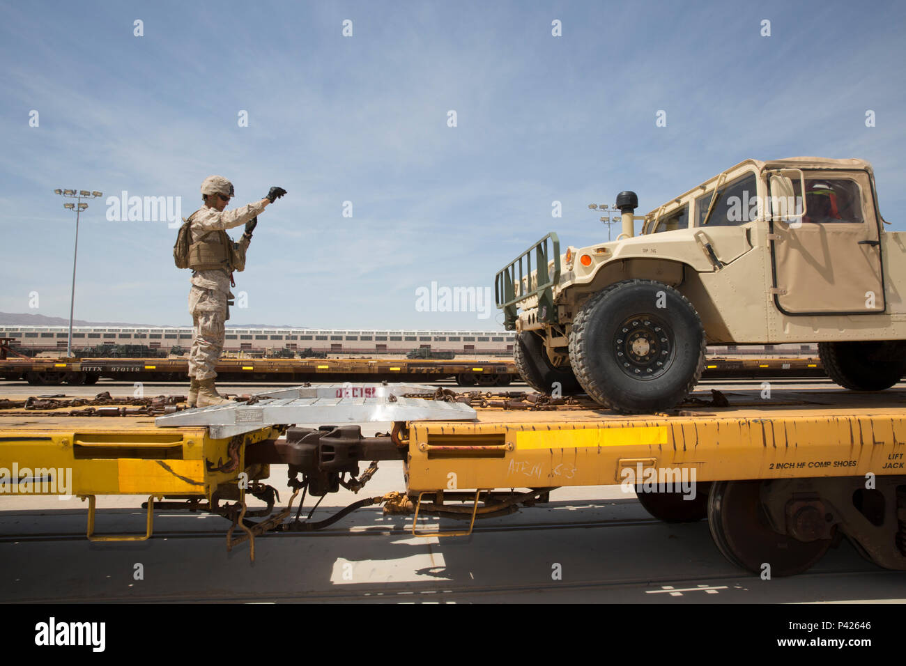 PFC Andrew Eckhardt of Combat Logistics Battalion 7 guides a humvee