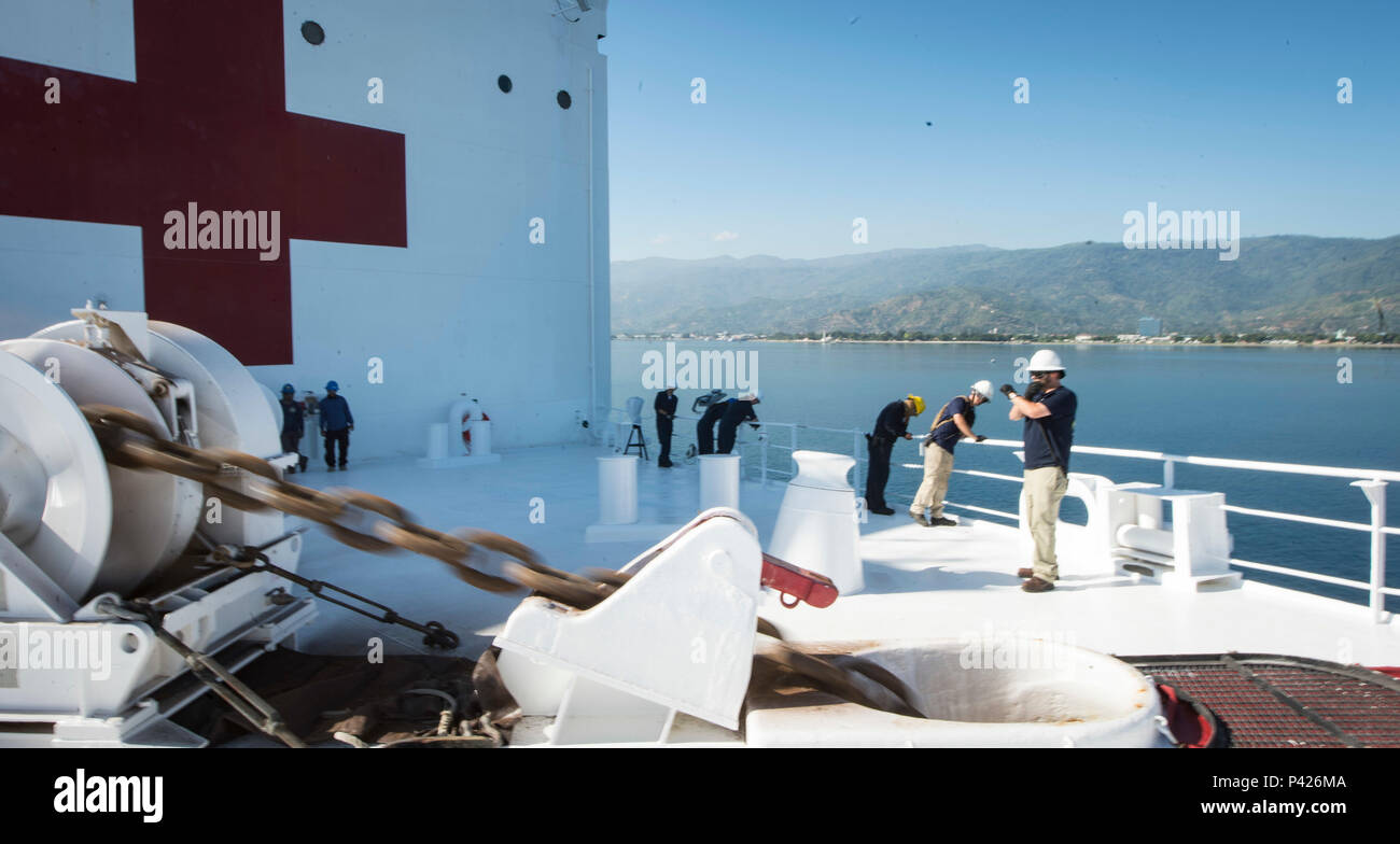 160608-N-QW941-051 DILI, Timor Leste (June 8, 2016) Crew members lower the anchor as hospital ship USNS Mercy (T-AH 19) anchors off the coast of Timor Leste. Deployed in support of Pacific Partnership 2016, Mercy, which has visited Timor Leste in five previous years, is making its first stop of the 2016 mission. Medical, engineering and various other personnel embarked aboard Mercy will work side-by-side with partner nation counterparts, exchanging ideas, building best practices and relationships to ensure preparedness should disaster strike.(U.S. Navy photo by Mass Communication Specialist 3r Stock Photo