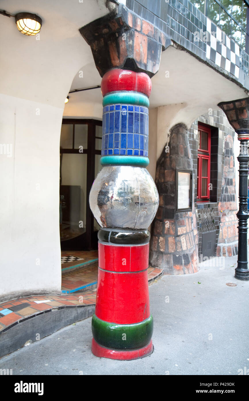 Colorful mosaic column, detail of famous Vienna landmark - Hundertwasserhaus. Vienna , Austria Stock Photo