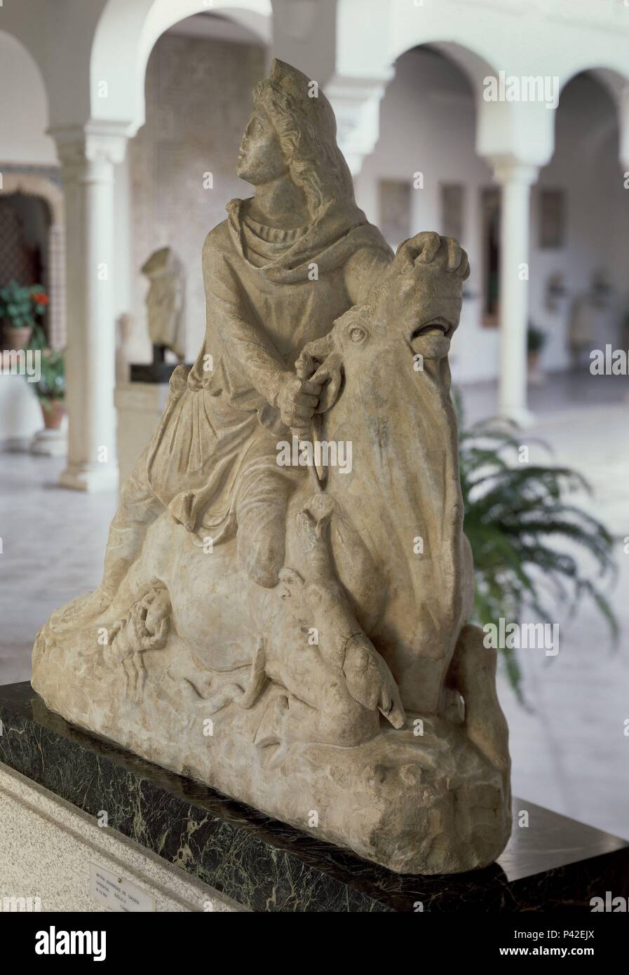 MITHRAS TAUROKTONOS - ESCULTURA ROMANA - MITOLOGIA ORIENTAL - RELIGION ROMANA - LUCHA ENTRE BIEN Y MAL - SIGLO II - 93x96x35 cm. Location: MUSEO ARQUEOLOGICO-COLECCION, CORDOBA. Stock Photo