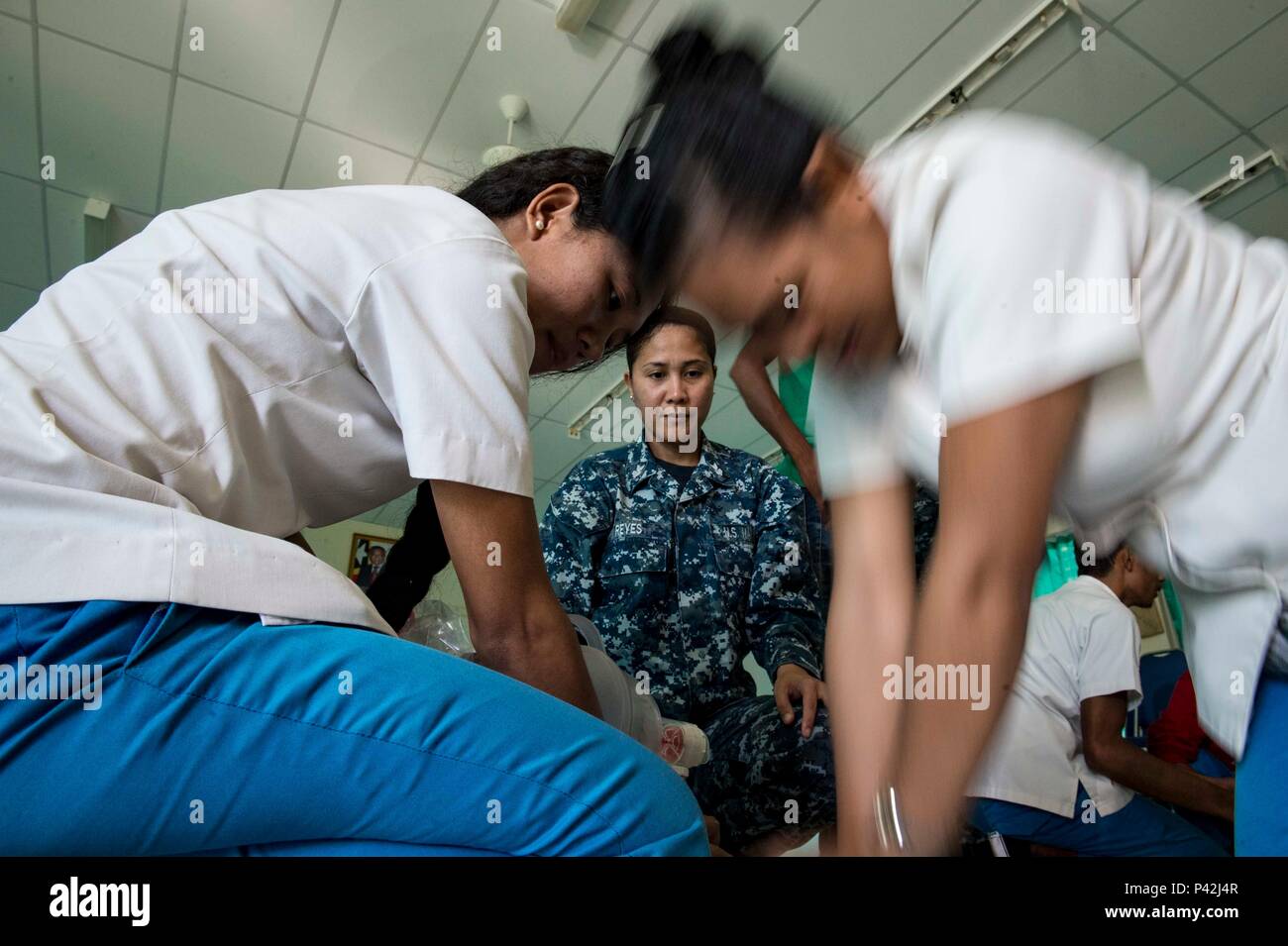 160610-N-QW941-127 DILI, Timor Leste (June 10, 2016) Hospital Corpsman 1st Class Rosella Reyes, a native of the Philippines, conducts basic life support training for Timorese students at the International Health Institute during Pacific Partnership 2016. This year marks the sixth time the mission visited Timor Leste since its first visit in 2006. Medical, engineering and various other personnel embarked aboard hospital ship USNS Mercy (T-AH 19) are working side-by-side with partner nation counterparts, exchanging ideas, building best practices and relationships to ensure preparedness should di Stock Photo