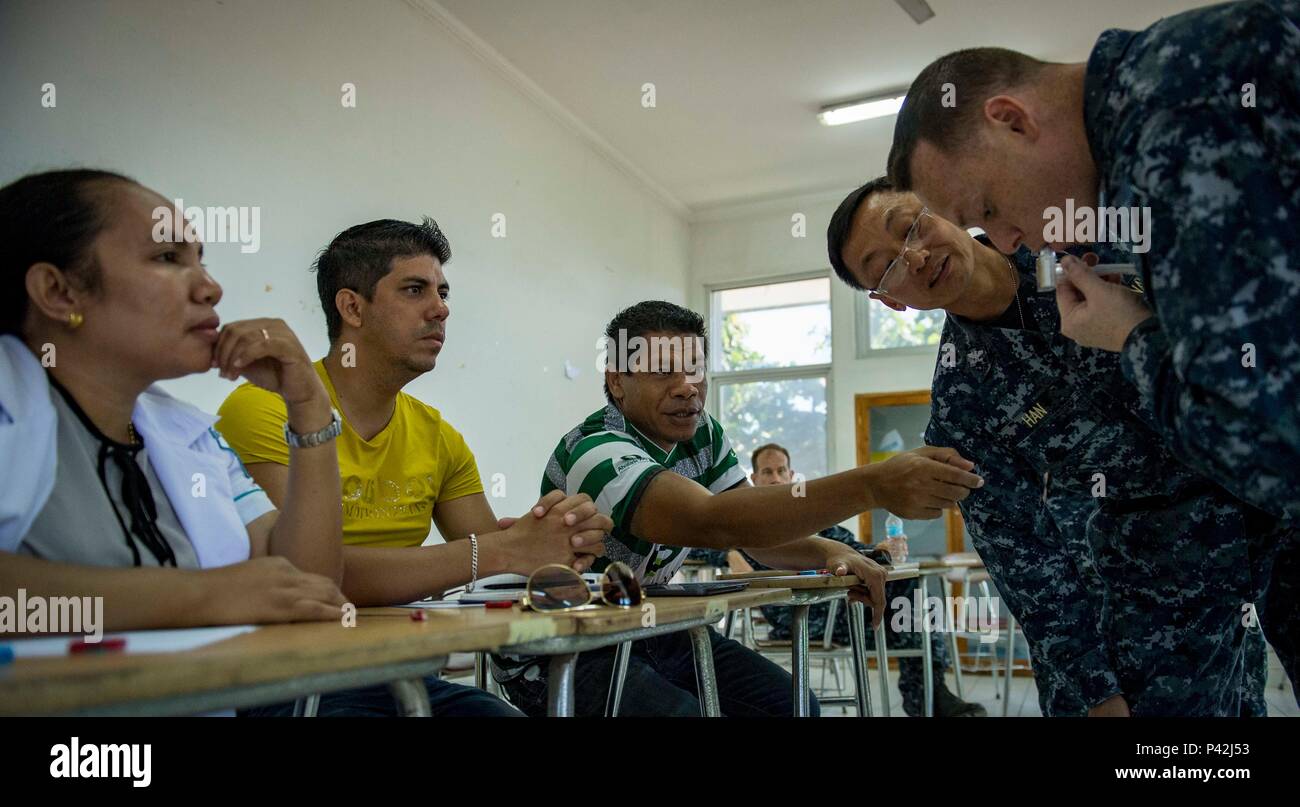 160610-N-QW941-219 DILI, Timor Leste (June 10, 2016) Hospital Corpsman 1st Class Joseph Montes (right), a native of Silverdale, Washington, interacts with Timorese nurses while conducting advanced life support training at the International Health Institute during Pacific Partnership 2016. This year marks the sixth time the mission visited Timor Leste since its first visit in 2006. Medical, engineering and various other personnel embarked aboard USNS Mercy (T-AH 19) are working side-by-side with partner nation counterparts, exchanging ideas, building best practices and relationships to ensure p Stock Photo