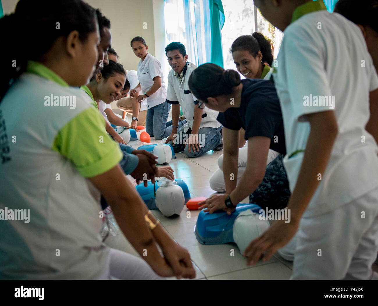 160610-N-QW941-239 DILI, Timor Leste (June 10, 2016) Hospital Corpsman 1st Class Elizabeth Jimenez, a native of Inglewood, California, conducts basic life support training for Timorese students at the International Health Institute during Pacific Partnership 2016. This year marks the sixth time the mission visited Timor Leste since its first visit in 2006. Medical, engineering and various other personnel embarked aboard hospital ship USNS Mercy (T-AH 19) are working side-by-side with partner nation counterparts, exchanging ideas, building best practices and relationships to ensure preparedness Stock Photo