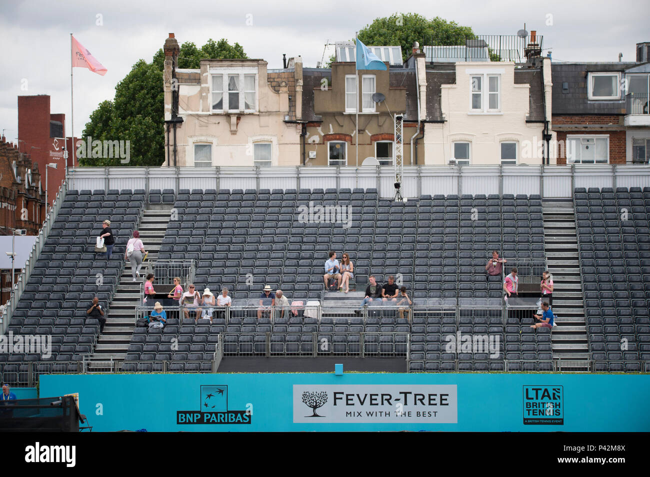 The Queens Club, 19 June 2018, London UK. Early morning spectators arrive on Court 1 for The Fever Tree tennis championships on Day 2. Stock Photo