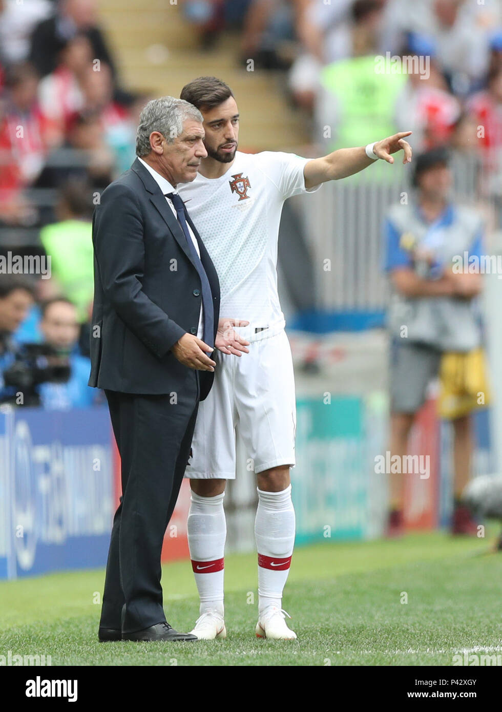 Moscow, Russia. 20th June, 2018. Portugal's head coach Fernando Santos (L) talks to Bruno Fernandes during a Group B match between Portugal and Morocco at the 2018 FIFA World Cup in Moscow, Russia, June 20, 2018. Credit: Xu Zijian/Xinhua/Alamy Live News Stock Photo