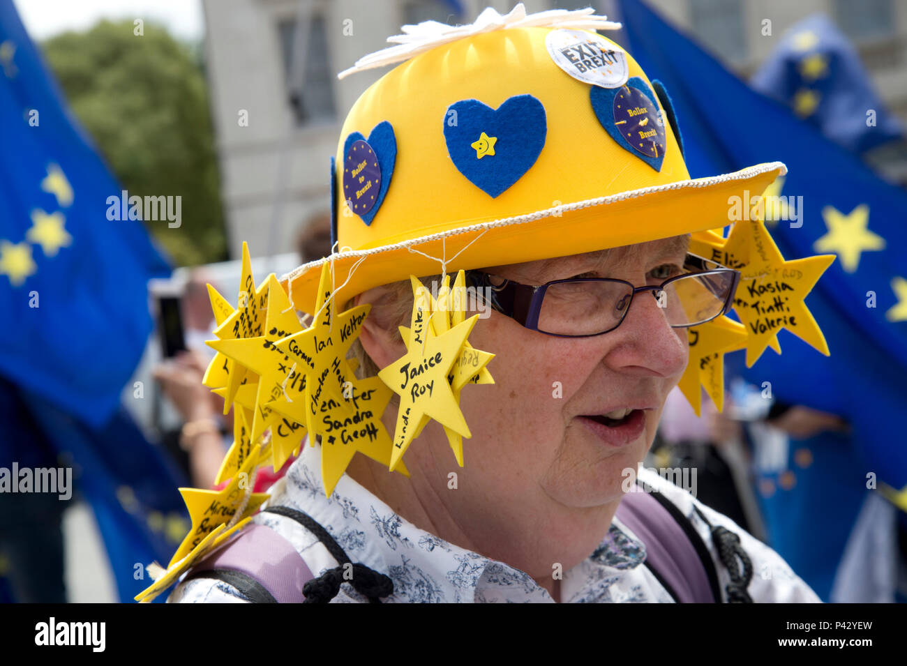 London, UK. 20 June 2018. Protesters outside  Parliament, Westminster, London as Members of Parliament debate the European Union withdrawal bill, June 20th 2018. A woman from Poole, Dorset wears a hat with the names of British ex patriates living in Spain who were not able to return to Britain to vote in the EU referendum. Credit: Jenny Matthews/Alamy Live News Stock Photo