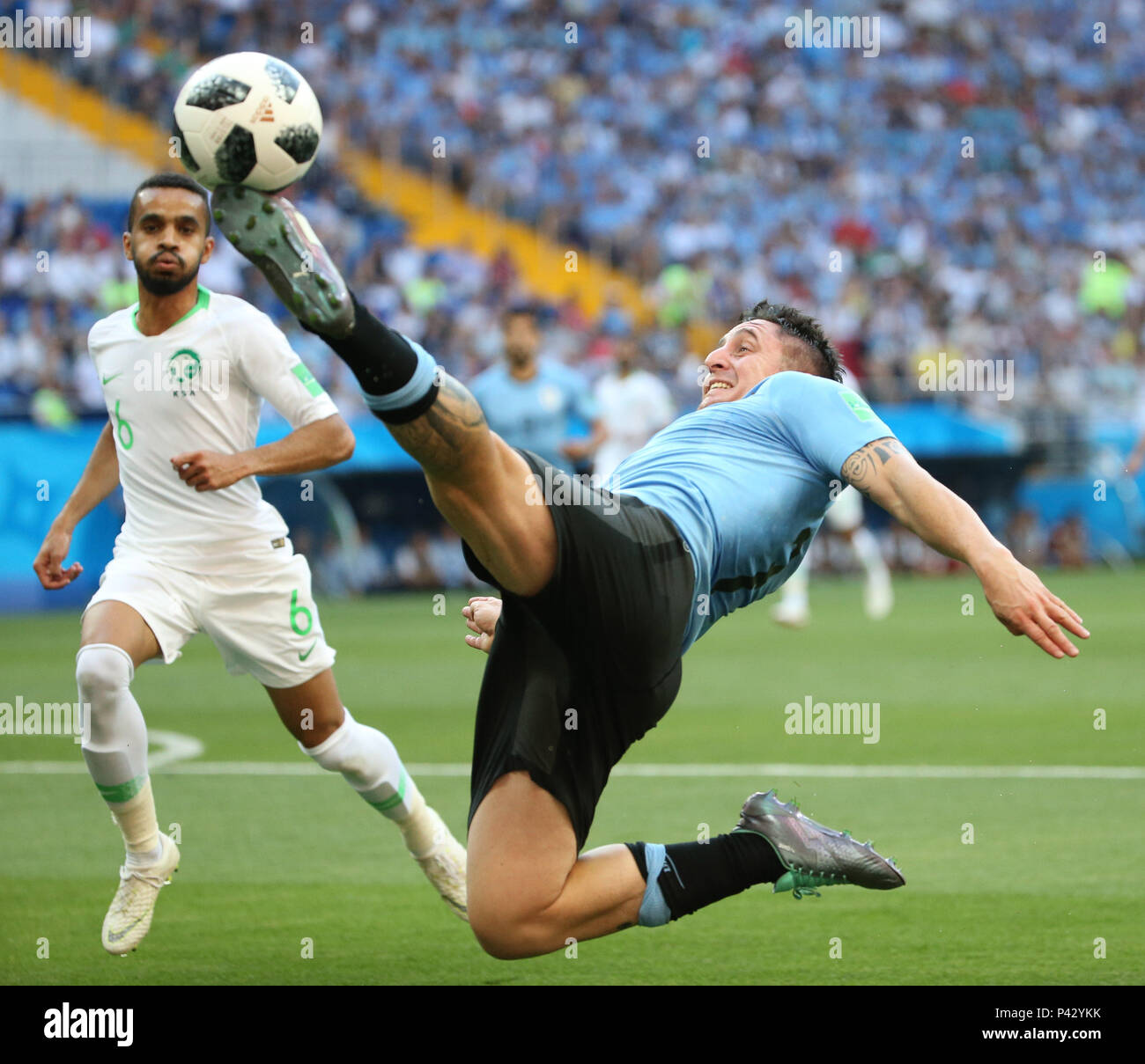 Rostov On Don. 20th June, 2018. Cristian Rodriguez (R) of Uruguay competes during a Group A match between Uruguay and Saudi Arabia at the 2018 FIFA World Cup in Rostov-on-Don, Russia, June 20, 2018. Credit: Li Ming/Xinhua/Alamy Live News Stock Photo