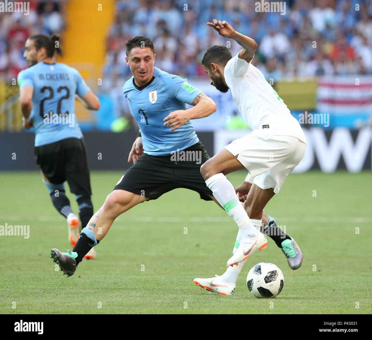 Rostov On Don. 20th June, 2018. Cristian Rodriguez (L front) of Uruguay vies with Salman Alfaraj (R) of Saudi Arabia during a Group A match between Uruguay and Saudi Arabia at the 2018 FIFA World Cup in Rostov-on-Don, Russia, June 20, 2018. Credit: Li Ming/Xinhua/Alamy Live News Stock Photo