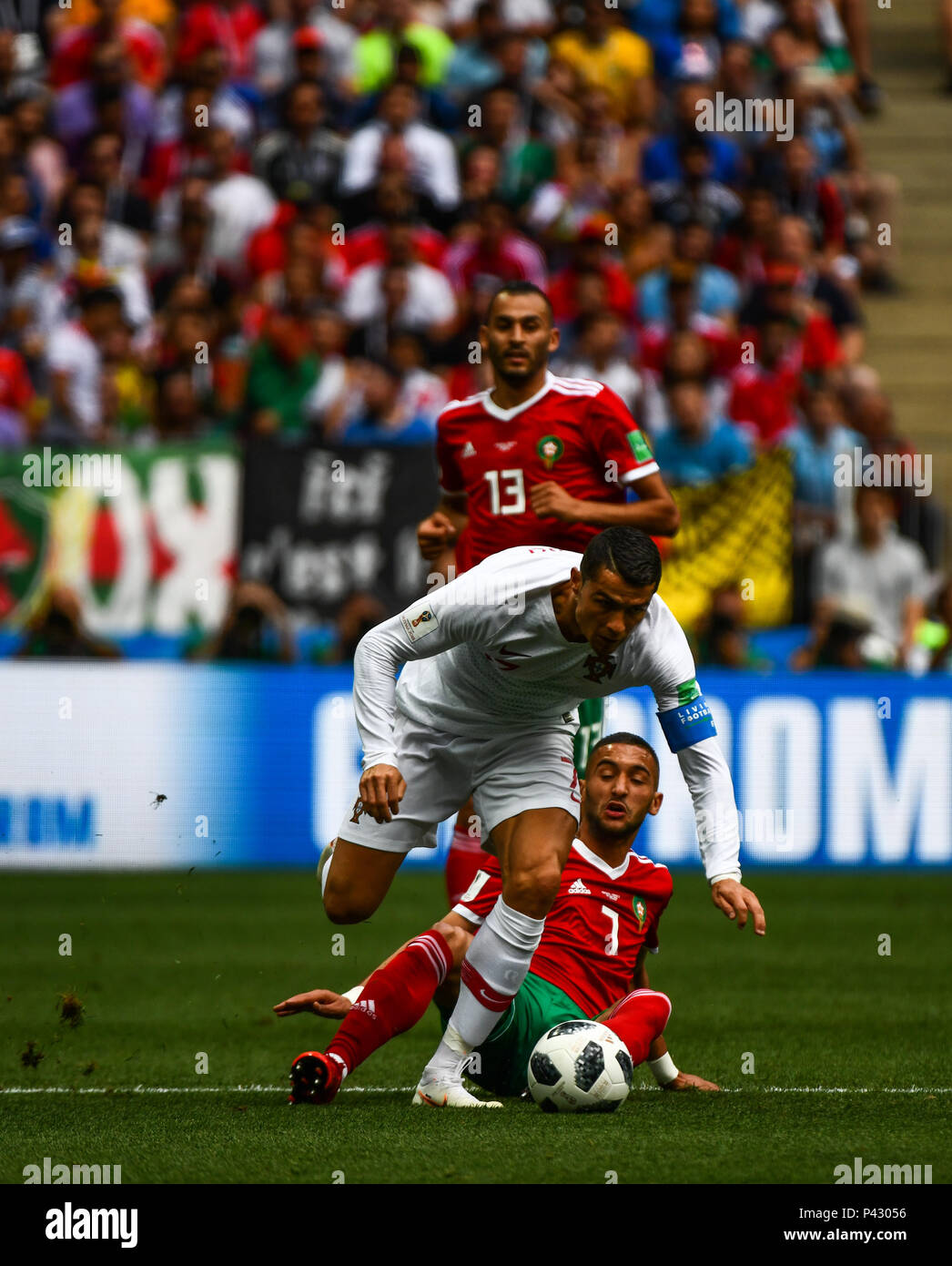 Luzhniki Stadium, Moscow, Russia. 20th June, 2018. FIFA World Cup Football, Group B, Portugal versus Morocco; Cristiano Ronaldo of Portugal skips the tackle from Hakim Ziyach of Morocco but is brought down Credit: Action Plus Sports/Alamy Live News Stock Photo