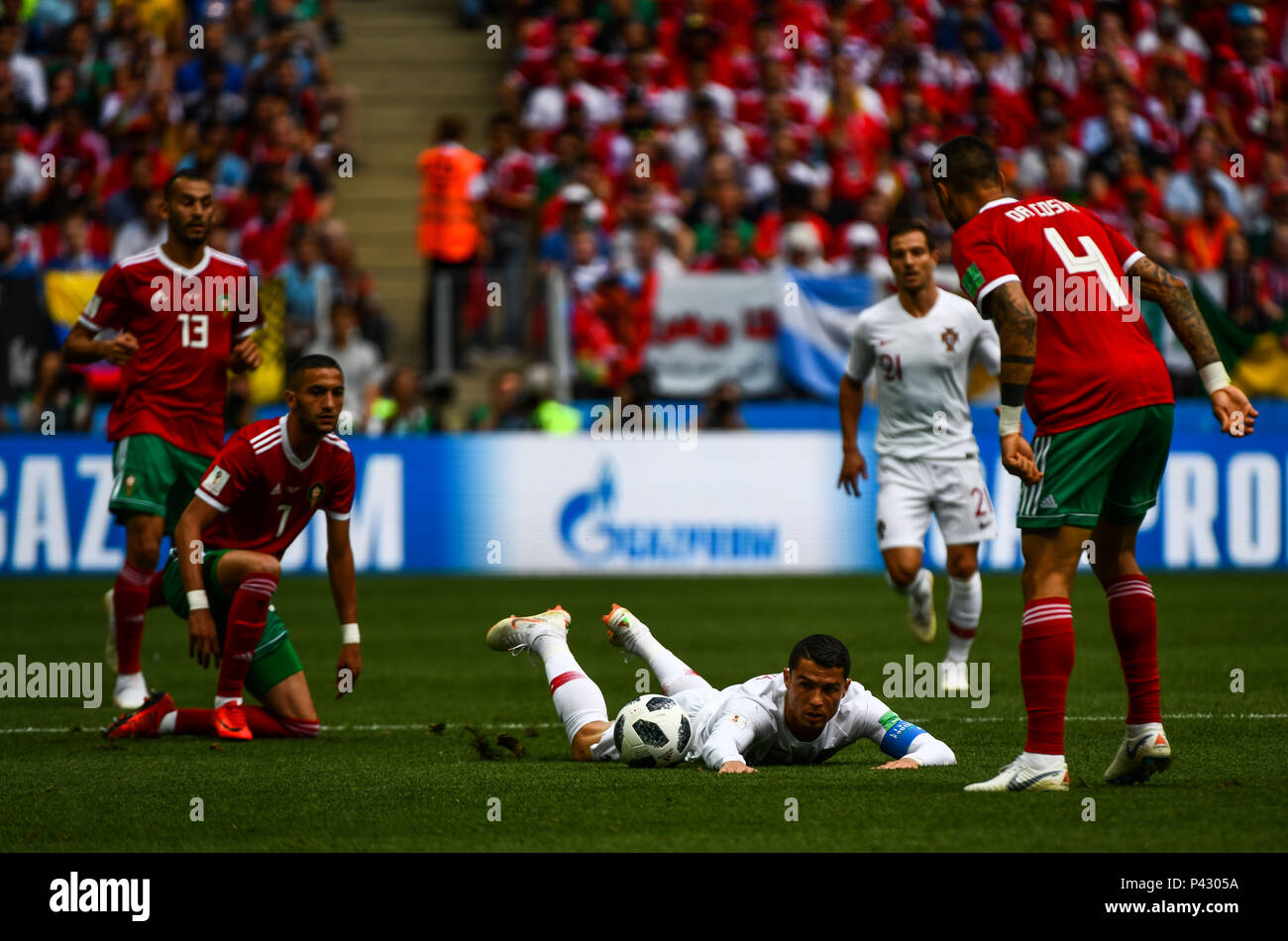 Luzhniki Stadium, Moscow, Russia. 20th June, 2018. FIFA World Cup Football, Group B, Portugal versus Morocco; Cristiano Ronaldo of Portugal skips the tackle from Hakim Ziyach of Morocco but is brought down Credit: Action Plus Sports/Alamy Live News Stock Photo