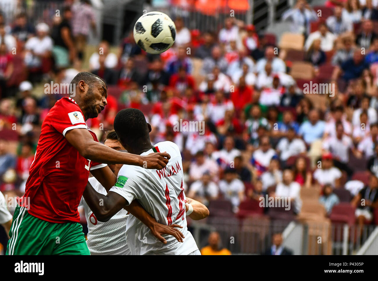 Luzhniki Stadium, Moscow, Russia. 20th June, 2018. FIFA World Cup Football, Group B, Portugal versus Morocco; Karim El Ahmadi of Morocco heading on goal as William Carvalho challenges Credit: Action Plus Sports/Alamy Live News Stock Photo